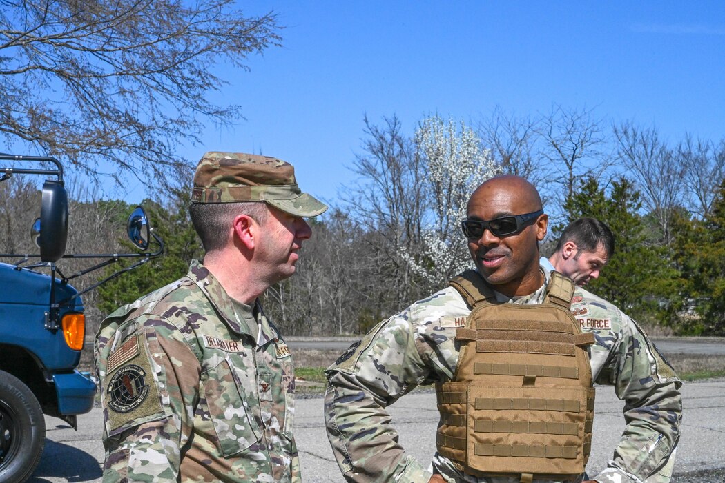 Two men in uniform talk to each other