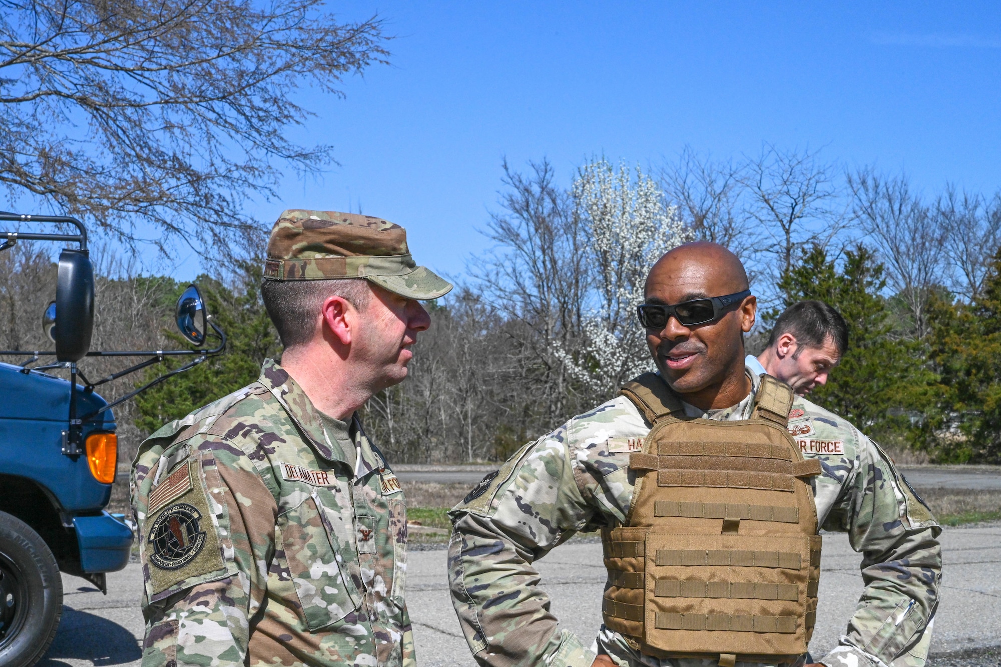 Two men in uniform talk to each other