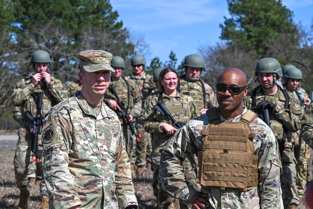Two men in uniform talk to each other.