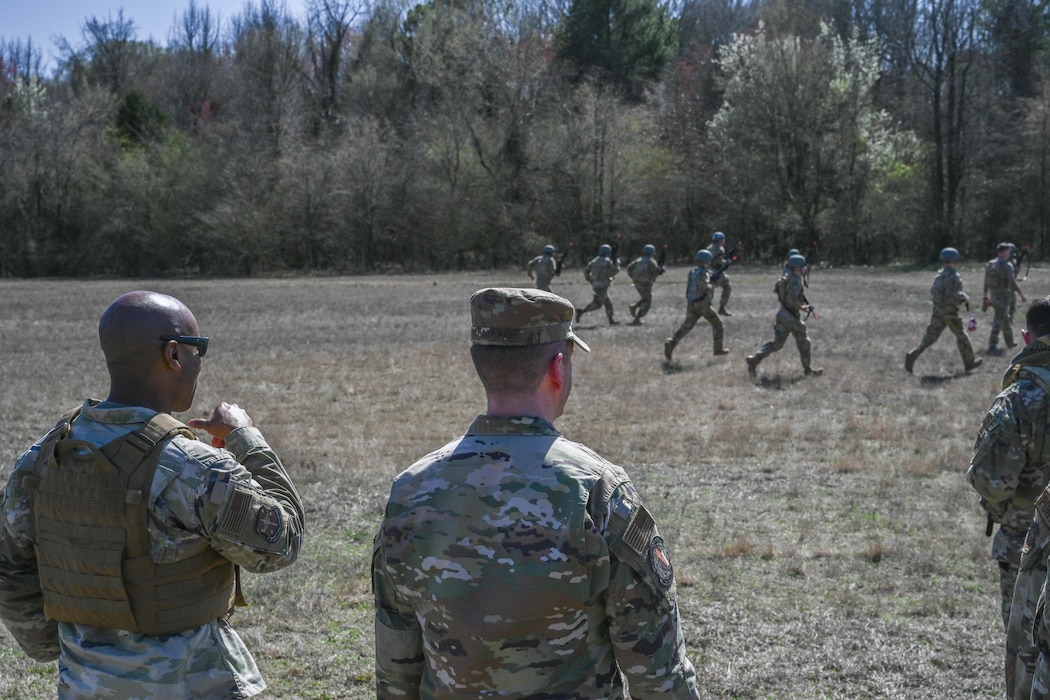 A man in uniform watches over a field