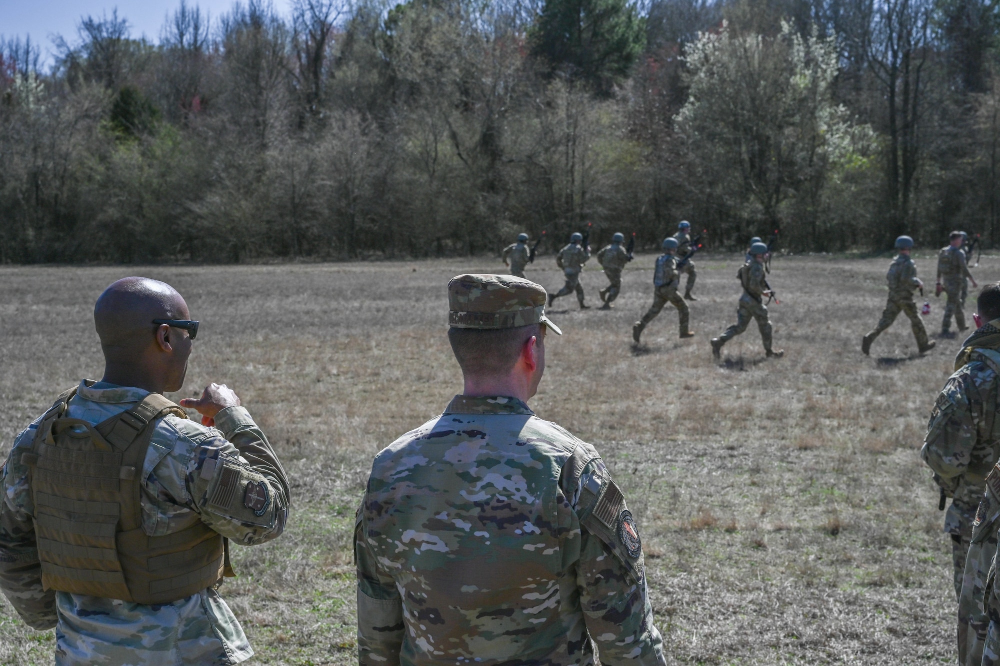 A man in uniform watches over a field