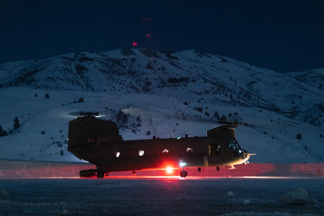 A U.S. Army CH-47 Chinook assigned to Company B, 1st Battalion, 126th Aviation Element with U.S. Army Soldiers with 1st Battalion, 75th Ranger Regiment, on board takes off during Mountain Warfare Training Exercise (MTX) 2-23 at Mountain Warfare Training Center, Bridgeport, California, Feb. 4, 2023. The purpose of MTX is to create a challenging and realistic training environment that produces combat-ready forces capable of operating in mountainous environments as an integrated Marine Air Ground Task Force (MAGTF) and to prepare units for their role in the MAGTF Warfighting Exercise. (U.S. Marine Corps photo by Cpl. Andrew Bray)