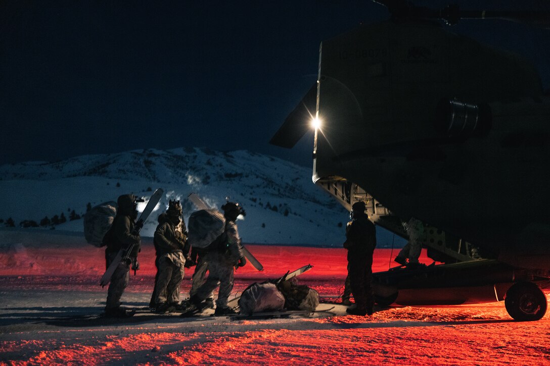 U.S. Army Soldiers with 1st Battalion, 75th Ranger Regiment, load into a CH-47 Chinook with Company B, 1st Battalion, 126th Aviation Element during Mountain Warfare Training Exercise (MTX) 2-23 at Mountain Warfare Training Center, Bridgeport, California, Feb. 4, 2023. The purpose of MTX is to create a challenging and realistic training environment that produces combat-ready forces capable of operating in mountainous environments as an integrated Marine Air Ground Task Force (MAGTF) and to prepare units for their role in the MAGTF Warfighting Exercise. (U.S. Marine Corps photo by Cpl. Andrew Bray)