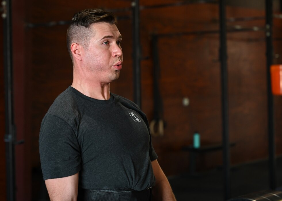 U.S. Air Force Capt. Matthew O’Neil, 17th Operational Medical Readiness Squadron general dentist, exhales during a workout of the day at CrossFit Diamond Steel, San Angelo, Texas, Feb. 27, 2023. O’Neil’s class keeps him motivated to stay fit and continue to improve. (U.S. Air Force photo by Senior Airman Ethan Sherwood)