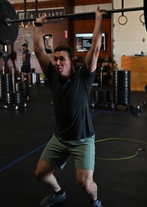 U.S. Air Force Capt. Matthew O’Neil, 17th Operational Medical Readiness Squadron general dentist, cleans a bar during a workout of the day at CrossFit Diamond Steel, San Angelo, Texas, Feb. 27, 2023. O’Neil maintained his fitness to improve both his physical and mental health. (U.S. Air Force photo by Senior Airman Ethan Sherwood)