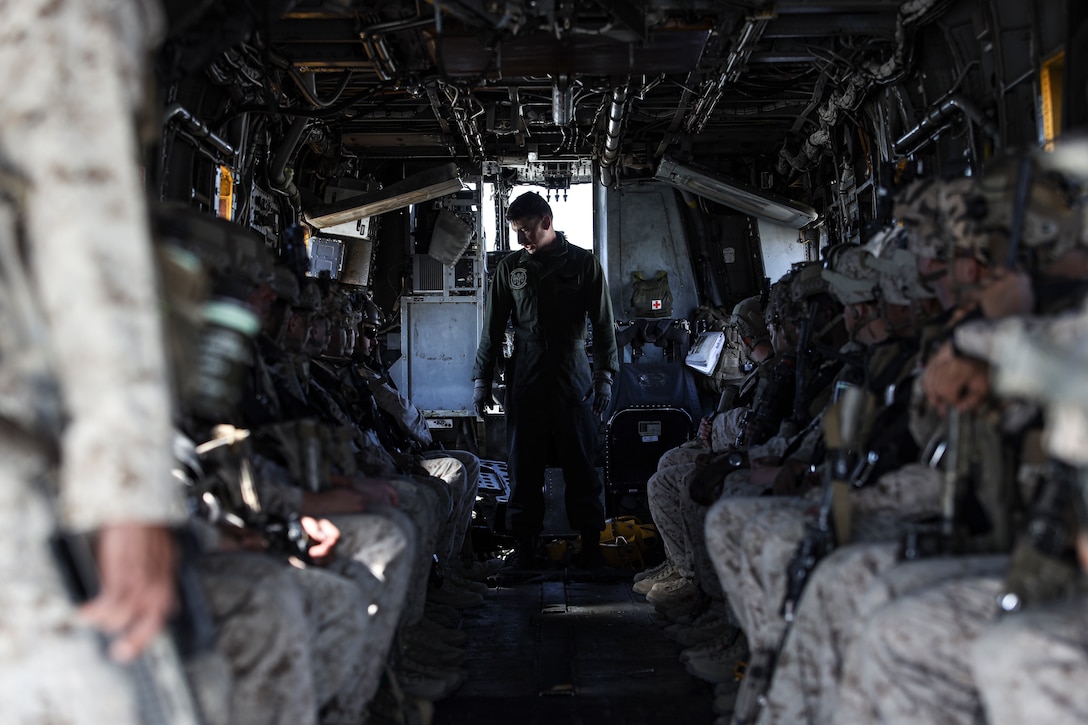 U.S. Marines with Fox Company, 2nd Battalion, 7th Marine Regiment (REIN), are briefed by a CH-53E Super Stallion crew chief during Marine Air Ground Task Force (MAGTF) Warfighting Exercise (MWX) 2-23 at Camp Wilson on Marine Corps Air Ground Combat Center, Twentynine Palms, California, Feb. 23, 2023. MWX is the culminating event of Service Level Training Exercise 2-23, that improves U.S. and allied service members’ operational capabilities. (U.S. Marine Corps photo by Lance Cpl. Pedro Arroyo)