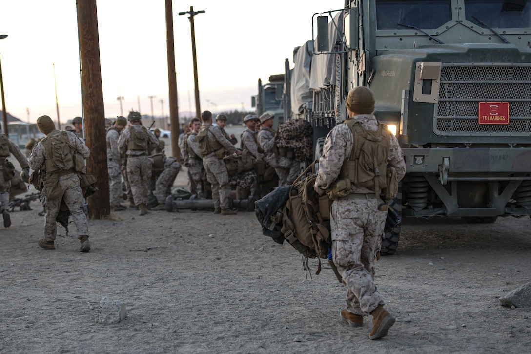U.S. Marines with Fox Company, 2nd Battalion, 7th Marine Regiment (REIN), prepare to load a Medium Tactical Vehicle Replacement during Marine Air Ground Task Force (MAGTF) Warfighting Exercise (MWX) 2-23 at Camp Wilson on Marine Corps Air Ground Combat Center, Twentynine Palms, California, Feb. 23, 2023. MWX is the culminating event of Service Level Training Exercise 2-23, that improves U.S. and allied service members’ operational capabilities. (U.S. Marine Corps photo by Lance Cpl. Pedro Arroyo)