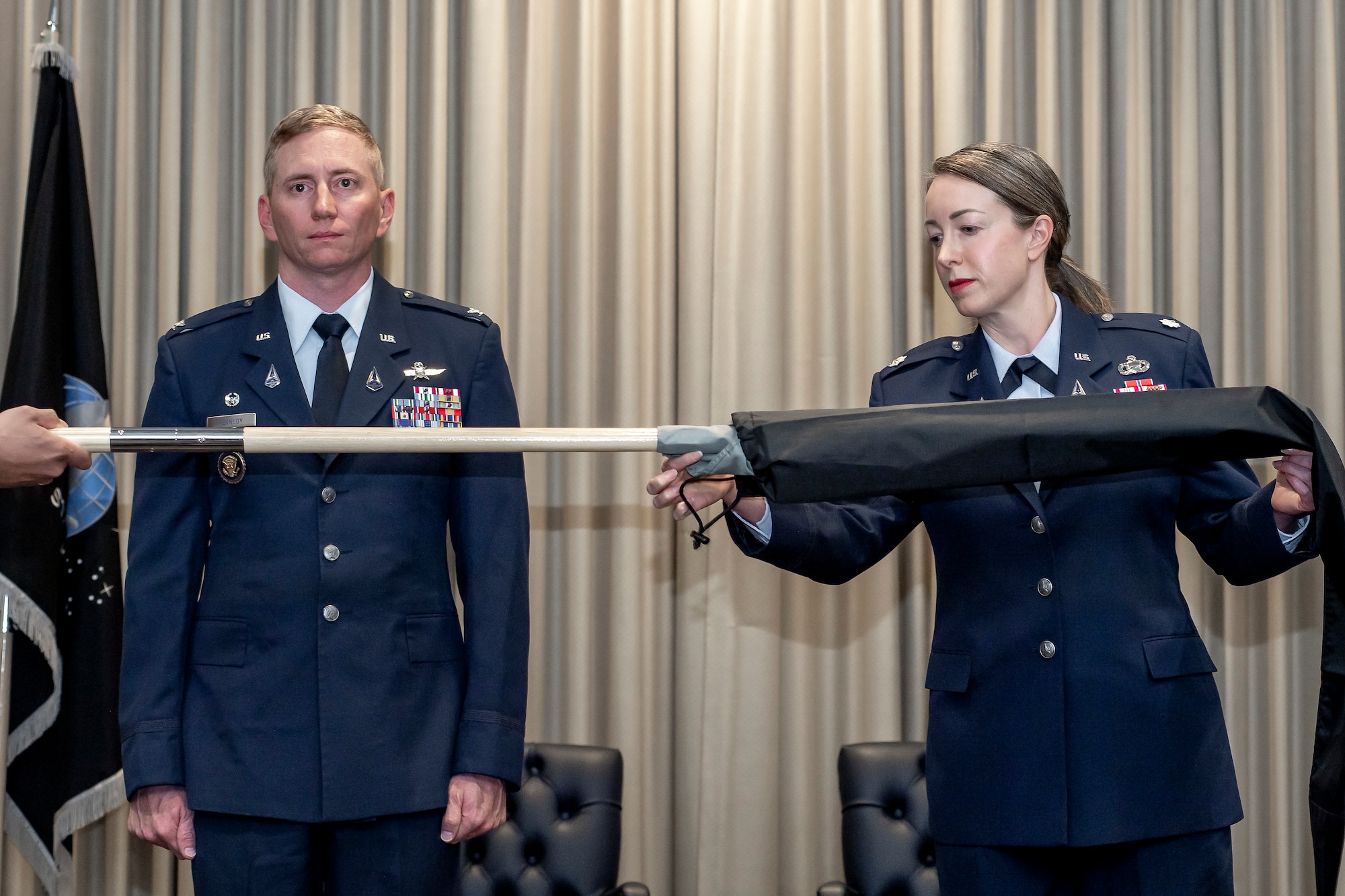 Two military members pose for photo.