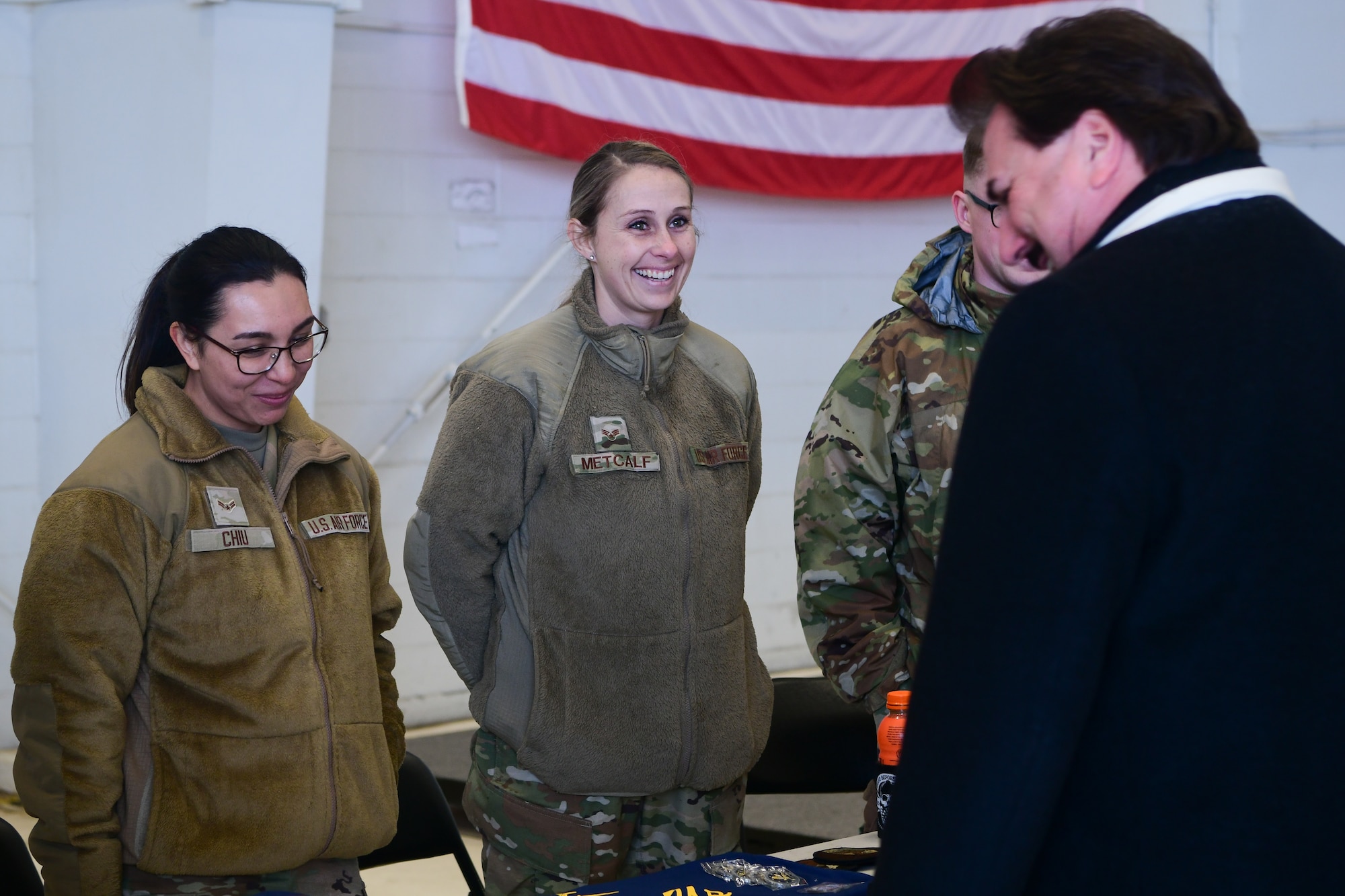 Airmen from the 9th Maintenance Squadron speak with Beale’s newly appointed honorary commanders during the immersion tour near the flight line on Beale Air Force Base, Calif.,  Feb. 24, 2023.