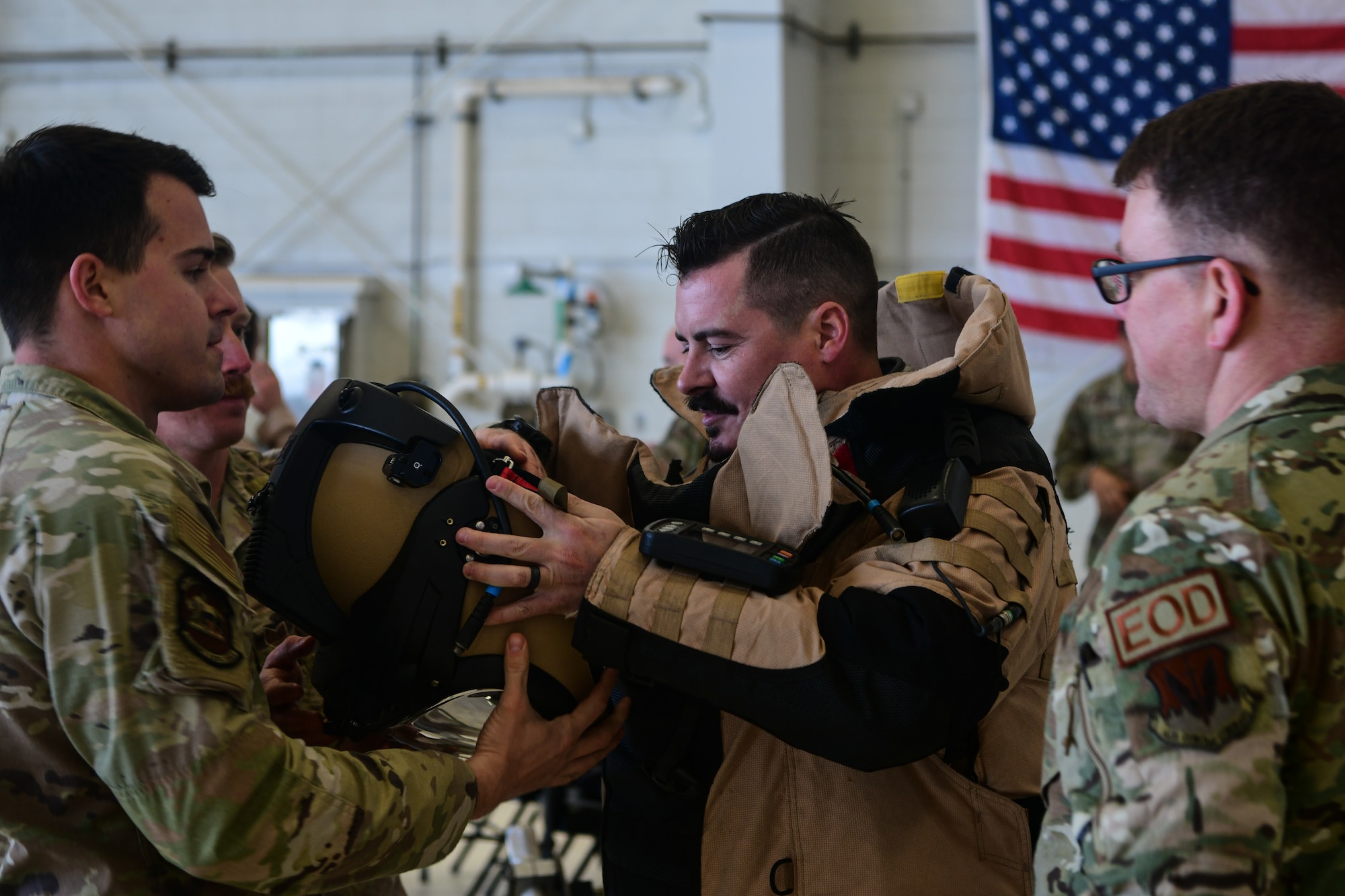 Chase Morrison, 9th Maintenance Group honorary commander and Sunset Moulding representative, dons an Explosive Ordnance Disposal bomb suit during the honorary commander immersion tour near the flight line at Beale Air Force Base, Calif., Feb. 24, 2023.