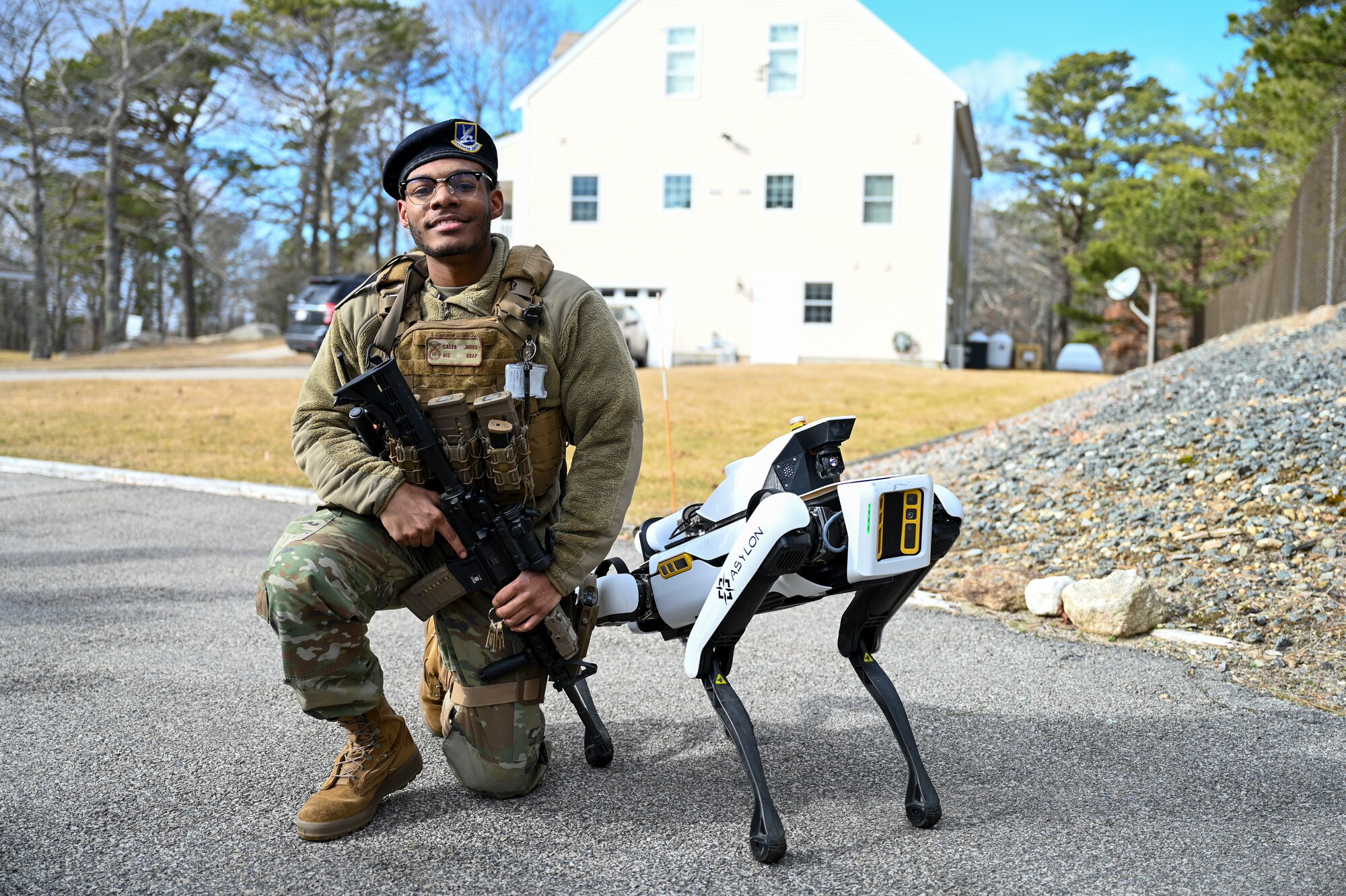 Robotic Dog poses with defender
