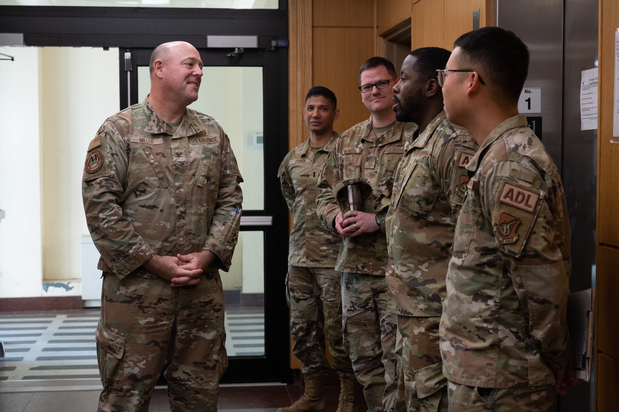 Col. Patrick Miller (left), Pacific Air Forces logistics, engineering and force protection director, listens to 8th Civil Engineer Squadron Airman dorm leaders, at Kunsan Air Base, Republic of Korea, Feb. 28, 2023. Miller visited several locations around the installation to view the infrastructure quality and talk about ways his team can support the Wolf Pack’s improvement plan. (U.S. Air Force photo by Staff Sgt. Sadie Colbert)