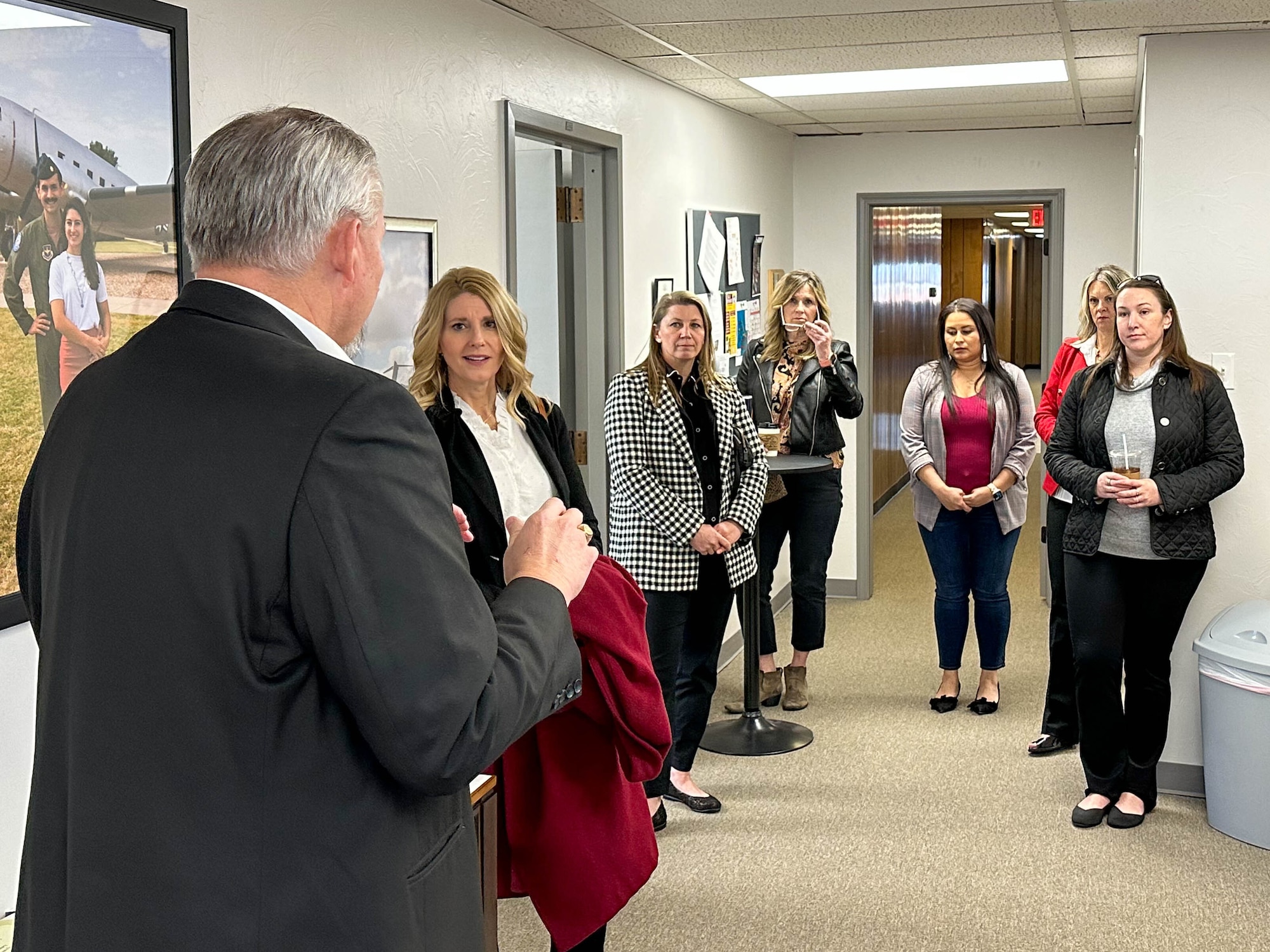 Rodger Kerr, Altus Chamber of Commerce president and CEO, talks with Cindy Lankford, wife of U.S. Sen. James Lankford of Oklahoma, and 97th Air Mobility Wing key spouses about the spouse coworking space at Altus, Oklahoma, Feb. 23, 2023. The space is a dedicated place for military spouses to mingle with the local community, network with local employers, and focus on their careers. (courtesy photo)