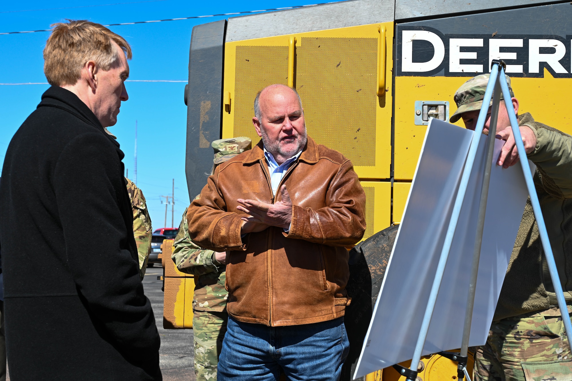 Gary Jones (center), Altus city manager, discusses a new off-base housing project in Altus, Oklahoma, with U.S. Sen. James Lankford of Oklahoma (left), Feb. 23, 2023. The project will add 156 housing units for the local community and service members at Altus Air Force Base. (U.S. Air Force photo by Senior Airman Trenton Jancze)