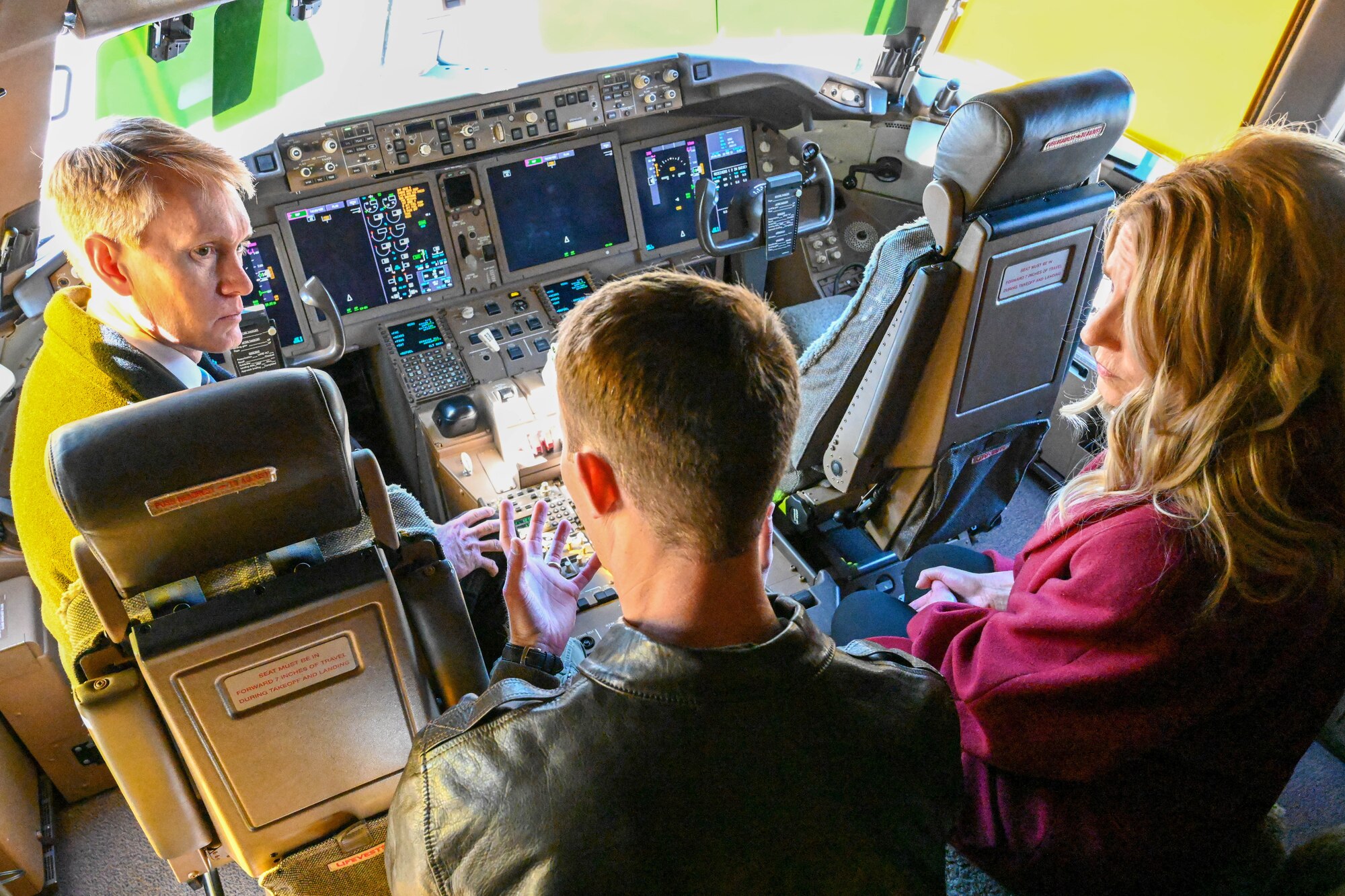 U.S. Air Force Capt. Philip Colwell (center), 97th Air Mobility Wing commander’s action group, showcases the cockpit of a KC-46 Pegasus to U.S. Sen. James Lankford of Oklahoma (left), and his wife Cindy (right), Feb. 23, 2023. During their visit, the Lankford’s had the opportunity to visit L. Mendel Rivers Elementary School, local housing projects, the spouse coworking space, a KC-46 Pegasus and other locations throughout the base. (U.S. Air Force photo by Senior Airman Trenton Jancze)