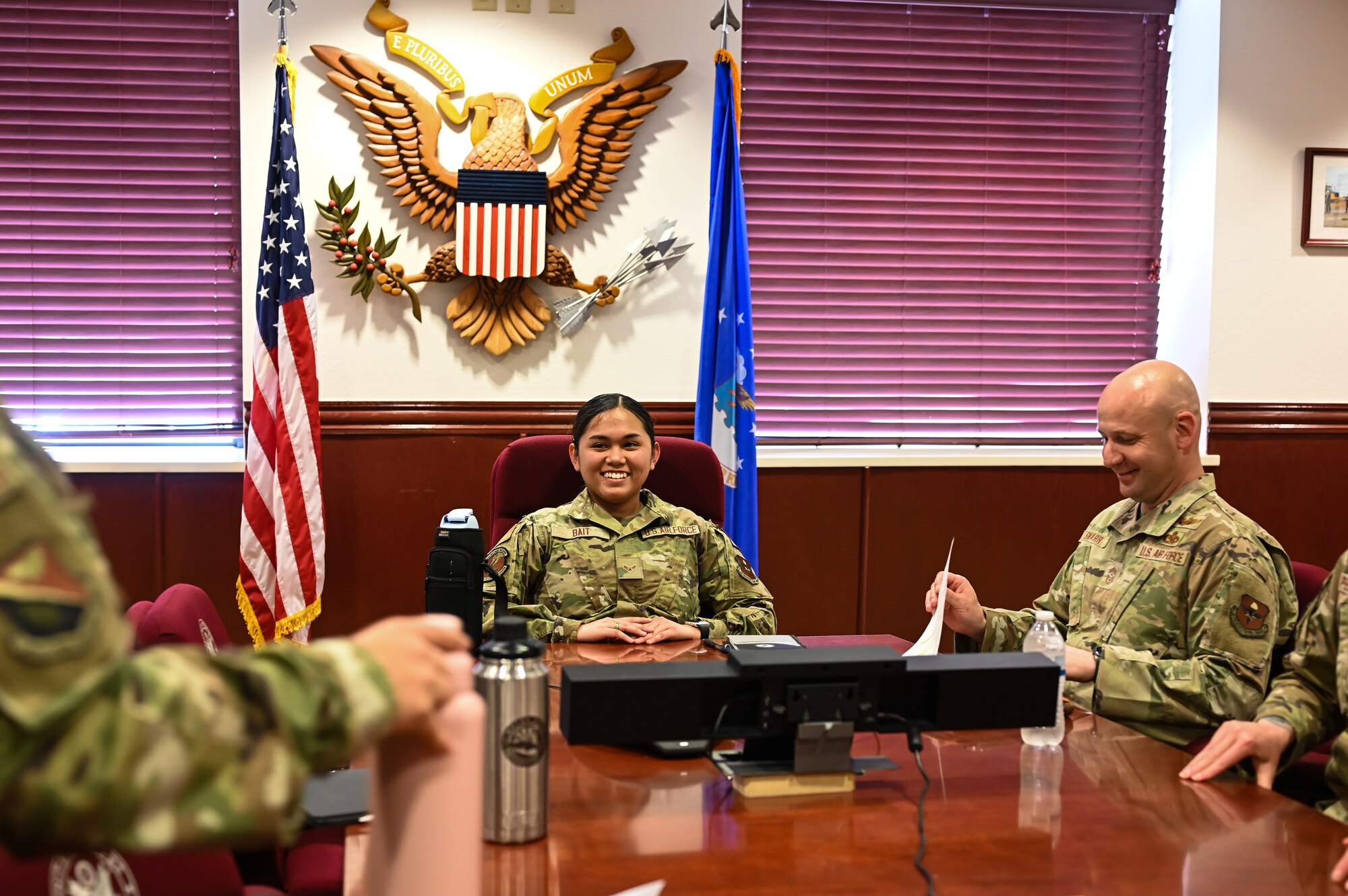 U.S. Air Force Airman 1st Class Natalie Bait (left), 47th Force Support Squadron career development technician, and Chief Master Sgt. David Snarr (right), 47th Flying Training Wing command chief, prepare to begin a meeting at Laughlin Air Force Base, Texas, on Feb. 22, 2023.