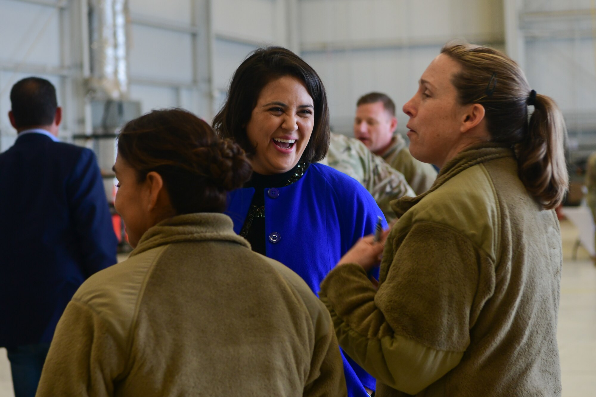 Sami Nall, 9th Operations Group honorary commander and Department of Water Resources engineer, speaks with U.S. Air Force Lt. Col. Alisha Earls, 9th Physiological Support Squadron commander, at the honorary commander immersion tour near the flight line at Beale Air Force Base, Calif., Feb. 24, 2023.