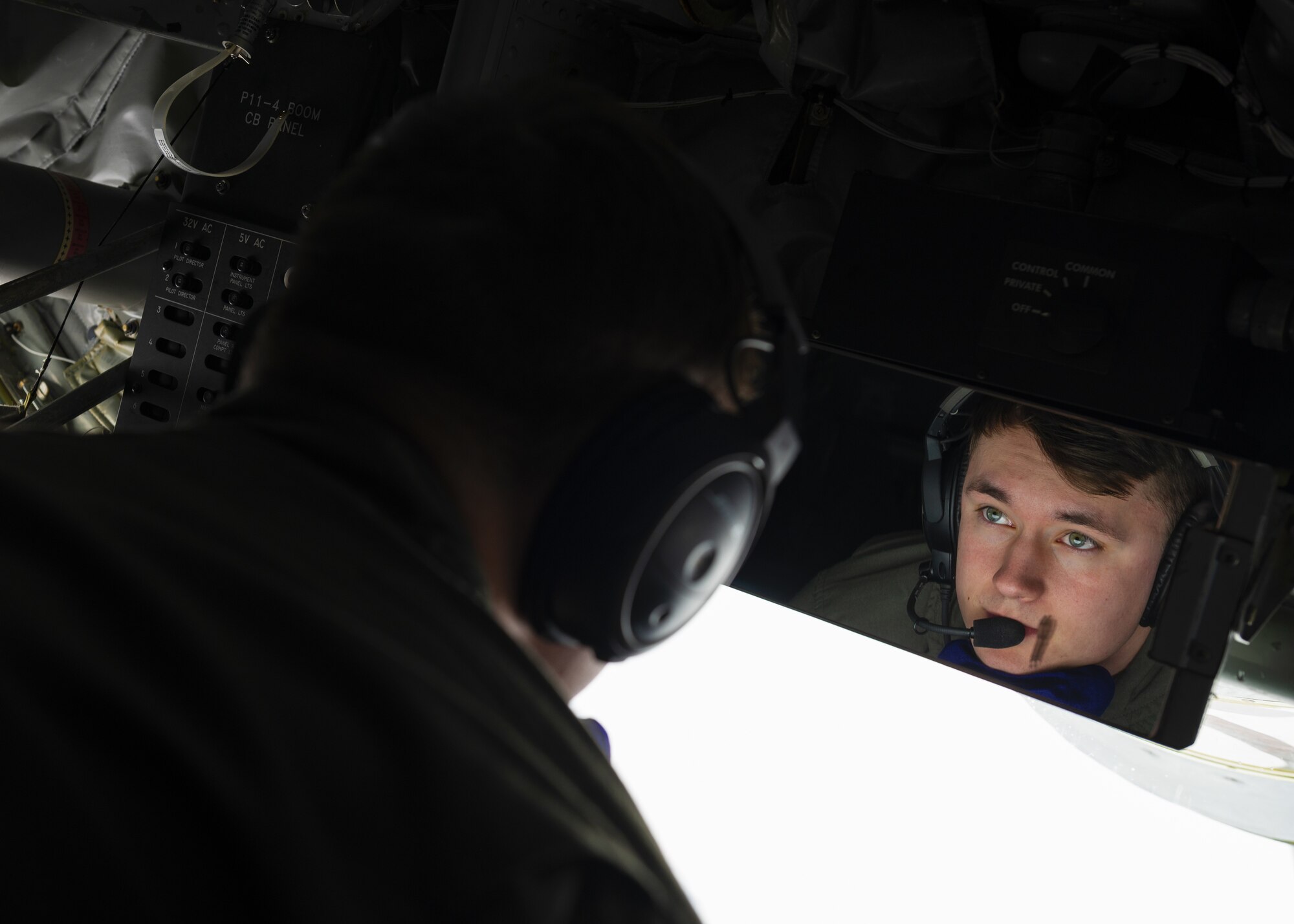 U.S. Air Force Senior Airman Sage Ledet, 384th Air Refueling Squadron inflight refueling specialist, prepares to perform aerial refueling during Fairchild’s Phase Two preparation exercise for Air Mobility Command’s capstone exercise, Mobility Guardian 2023, Feb. 14, 2023. The Phase 2 exercise emphasized aircrew endurance, dynamic air refueling concepts, testing of a variety of the KC-135 mission sets, and included an advanced 72-hour endurance event. (U.S. Air Force photo by Staff Sgt. Lawrence Sena)