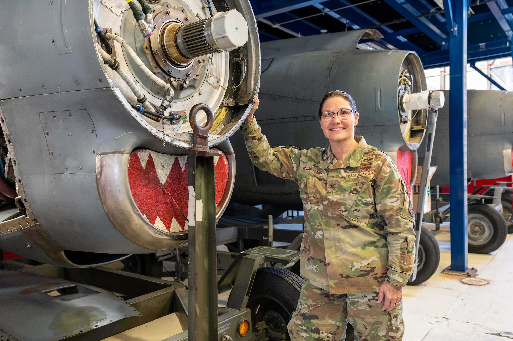 Colonel Gia Wilson-Mackey, 934th Maintenance Group Commander, poses in front of equipment at the engine shop at the Minneapolis-St. Paul Air Reserve Station, Feb. 25, 2023. Wilson-Mackey will officially assume command during the March UTA as the first female 934 MXG commander. (U.S. Air Force photo by Master Sgt. Trevor Saylor)