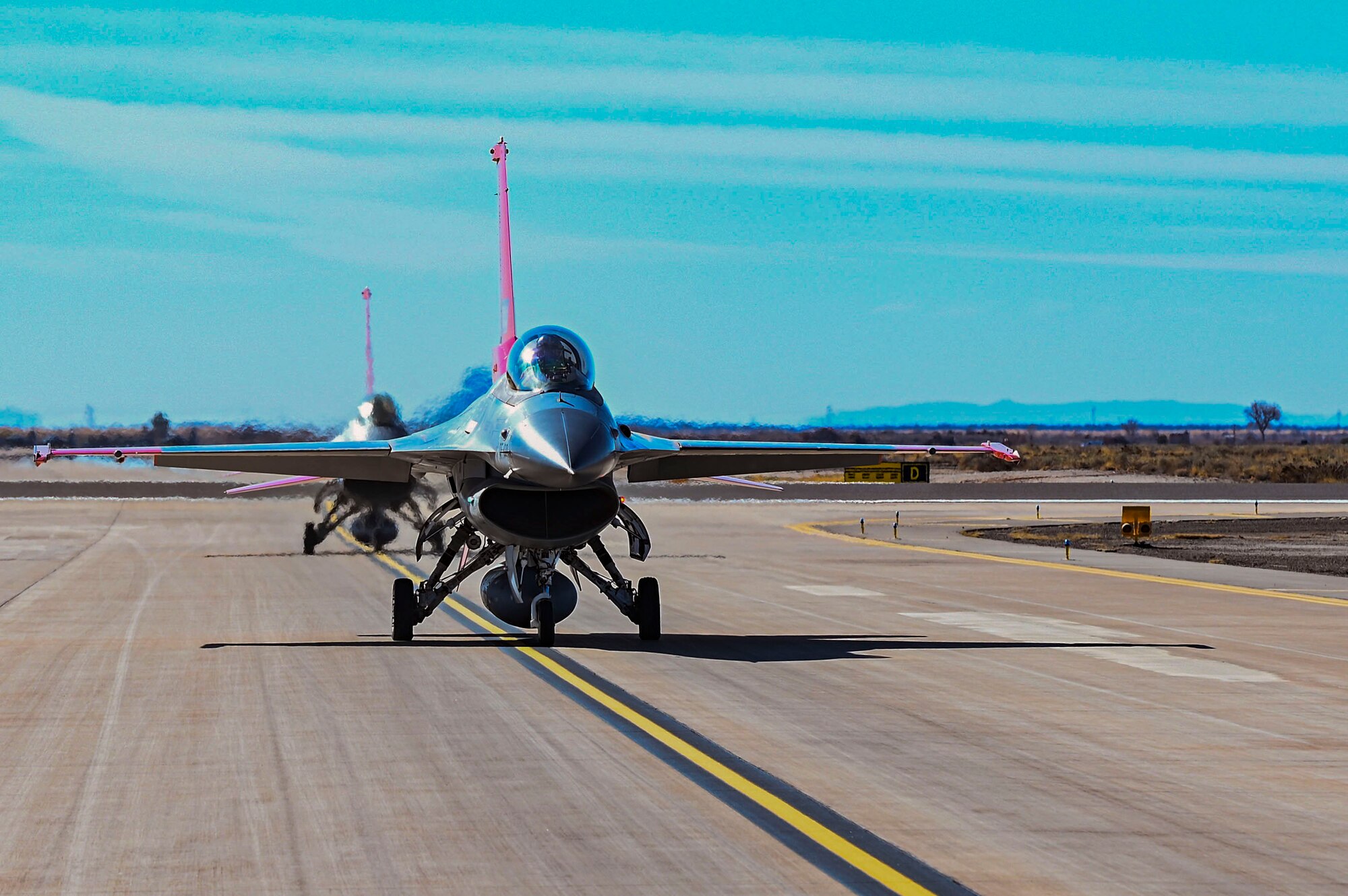 Two QF-16 Vipers from the 82nd Aerial Targets Squadron Detachment 1, taxi on the flightline at Holloman Air Force Base, New Mexico, Feb. 22, 2023.The 82nd ATRS is responsible for providing QF-16s for customers’ system tests that require aerial targets for weapons testing. (U.S. Air Force photo by Airman 1st Class Isaiah Pedrazzini)