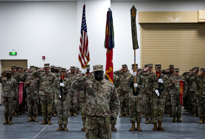 U.S. Army Maj. Earl Bright, 4th Battalion 3rd Air Defense Artillery Regiment (4-3 ADA) operations officer and commander of troops, salutes with the 4-3 ADA as the Star-Spangled Banner is performed at the 4-3 ADA Transfer of Authority, Jan. 26, 2023. The 4-3 ADA completed the Transfer of Authority with the 2nd Battalion 43rd Air Defense Artillery Regiment (2-43 ADA) taking charge of the Patriot Battery defense system at Al Dhafra Air Base, United Arab Emirates.