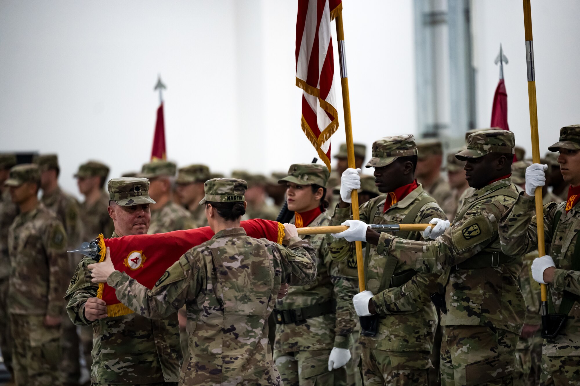 U.S. Army Lt. Col. Paul Mendoza, Commander of the 4th Battalion 3rd Air Defense Artillery Regiment (4-3 ADA), and U.S. Army Command Sgt. Maj. Brooke Martin, 4-3 ADA command sergeant major, case the 4-3 ADA flag during a transfer of authority on Jan. 26, 2023, Al Dhafra Air Base, United Arab Emirates. The 4-3 ADA transferred responsibility of the MIM-104 Patriot missile systems at Al Dhafra AB to the 2nd Battalion 43rd Air Defense Artillery Regiment before returning to garrison at Ft. Sill, Oklahoma.