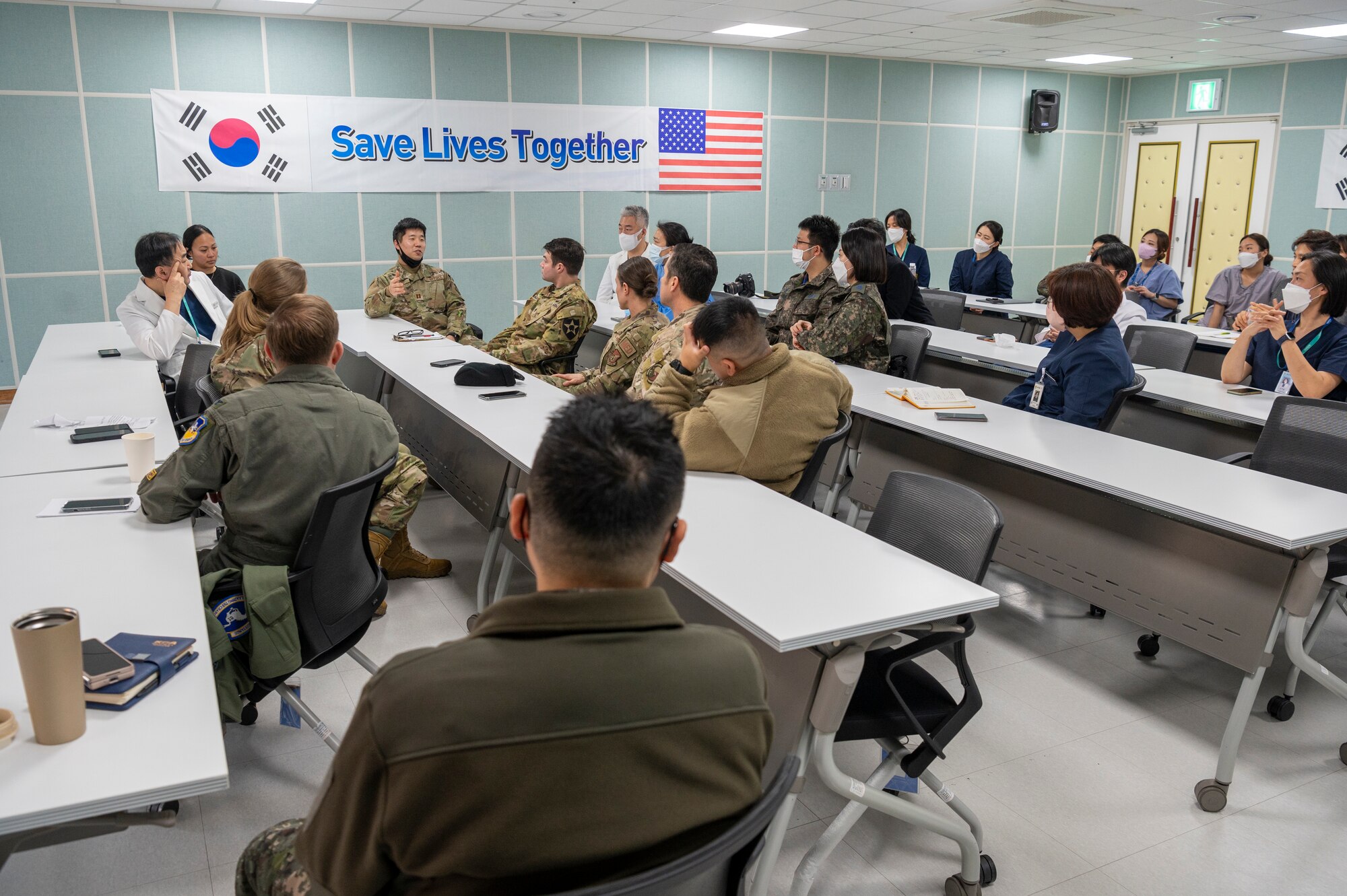 51st Medical Group personnel and Republic of Korea Armed Forces Trauma Center (AFTC) personnel debrief after the joint trauma training event at the AFTC, Republic of Korea, Feb. 28, 2023. The 51st MDG and AFTC personnel discussed obstacles encountered during the training event and how the teams can improve. (U.S. Air Force photo by Airman 1st Class Aaron Edwards)
