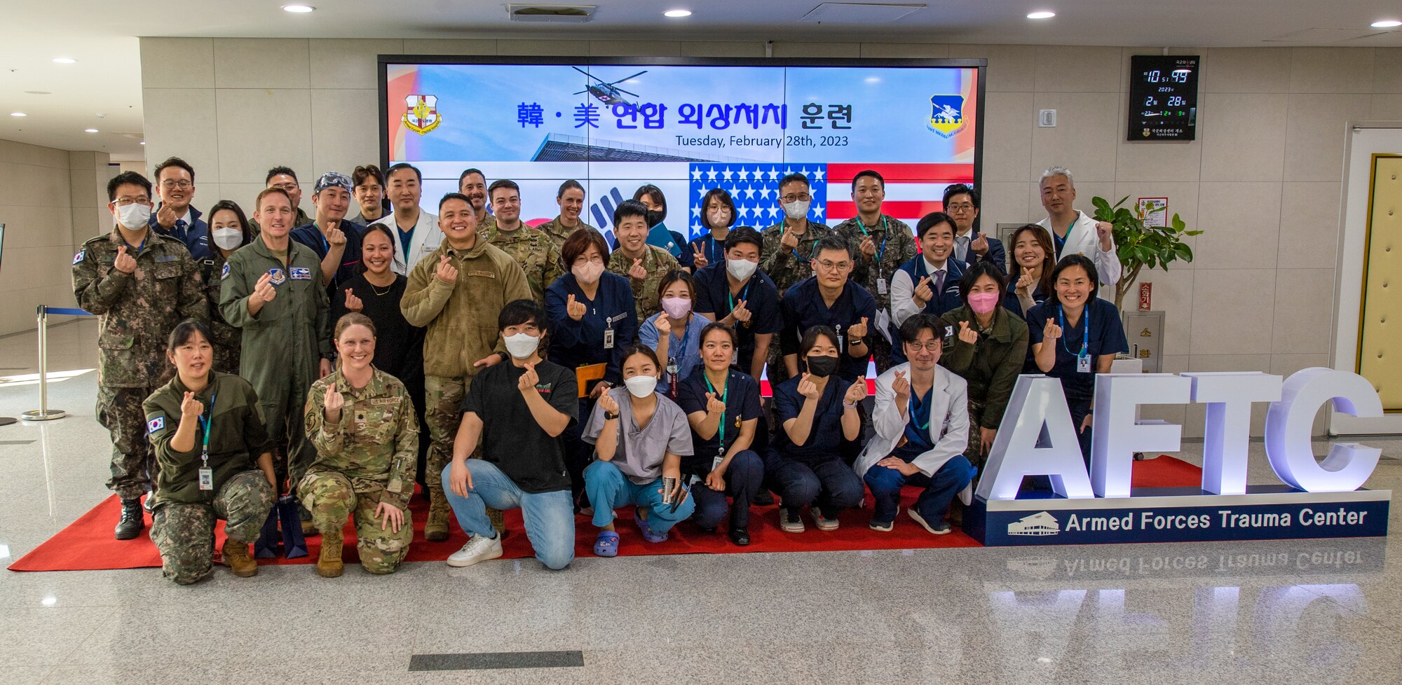Personnel from the 51st Medical Group, 3-2 General Support Aviation Battalion and Republic of Korea Armed Forces Trauma Center (AFTC) pose for a group photo after the joint trauma training event at the AFTC, Republic of Korea, Feb. 28, 2023. The training event allowed the 51st MDG, 3-2 GSAB and AFTC to train treating trauma patients jointly. (U.S. Air Force photo by Airman 1st Class Aaron Edwards)