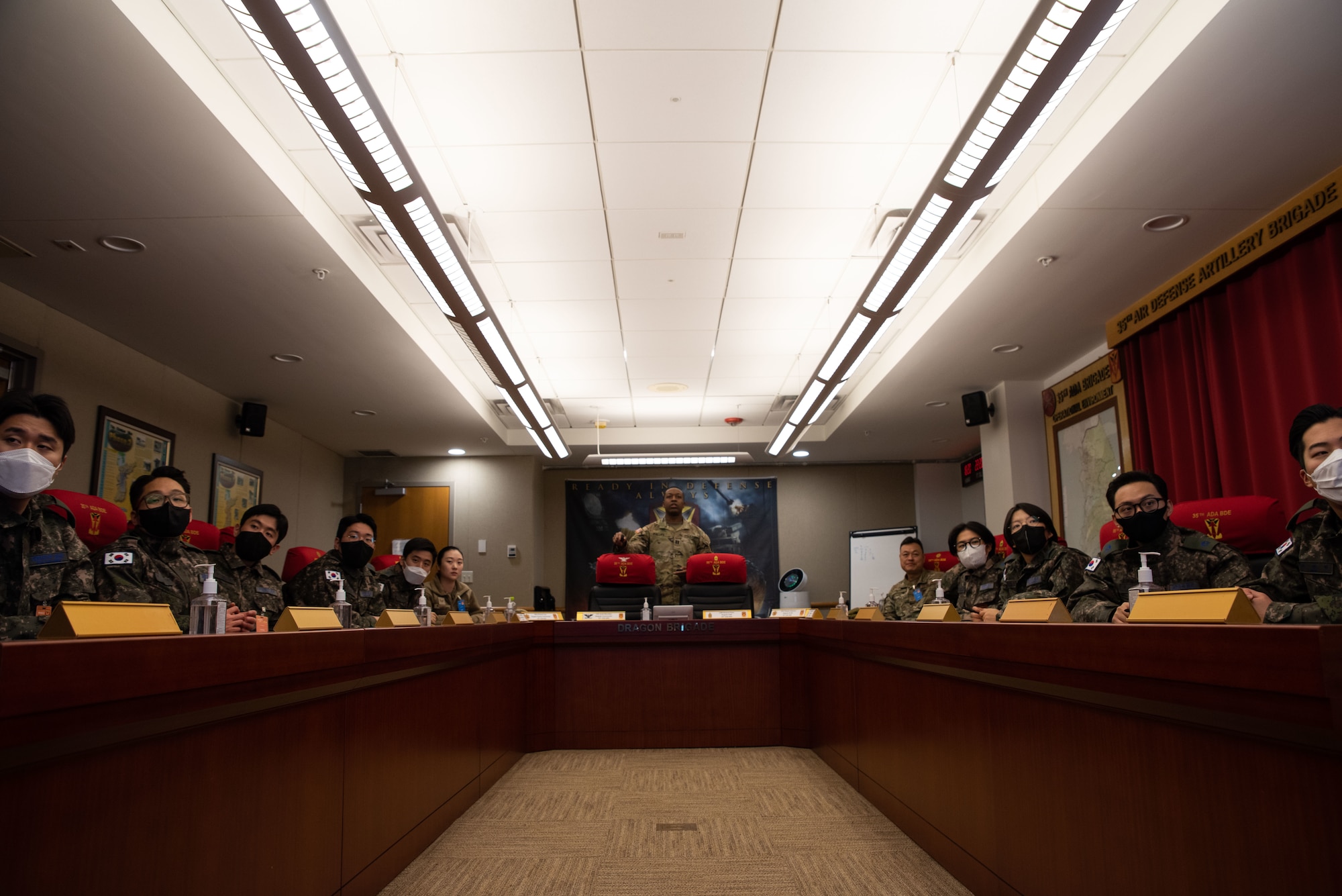 U.S. Army Capt. Eric Phillips, 35th Air Defence Artillery assistant operations officer, briefs Republic of Korea Air Force interpretation officers in training during an immersion tour at Osan Air Base, ROK, Feb. 23, 2023.