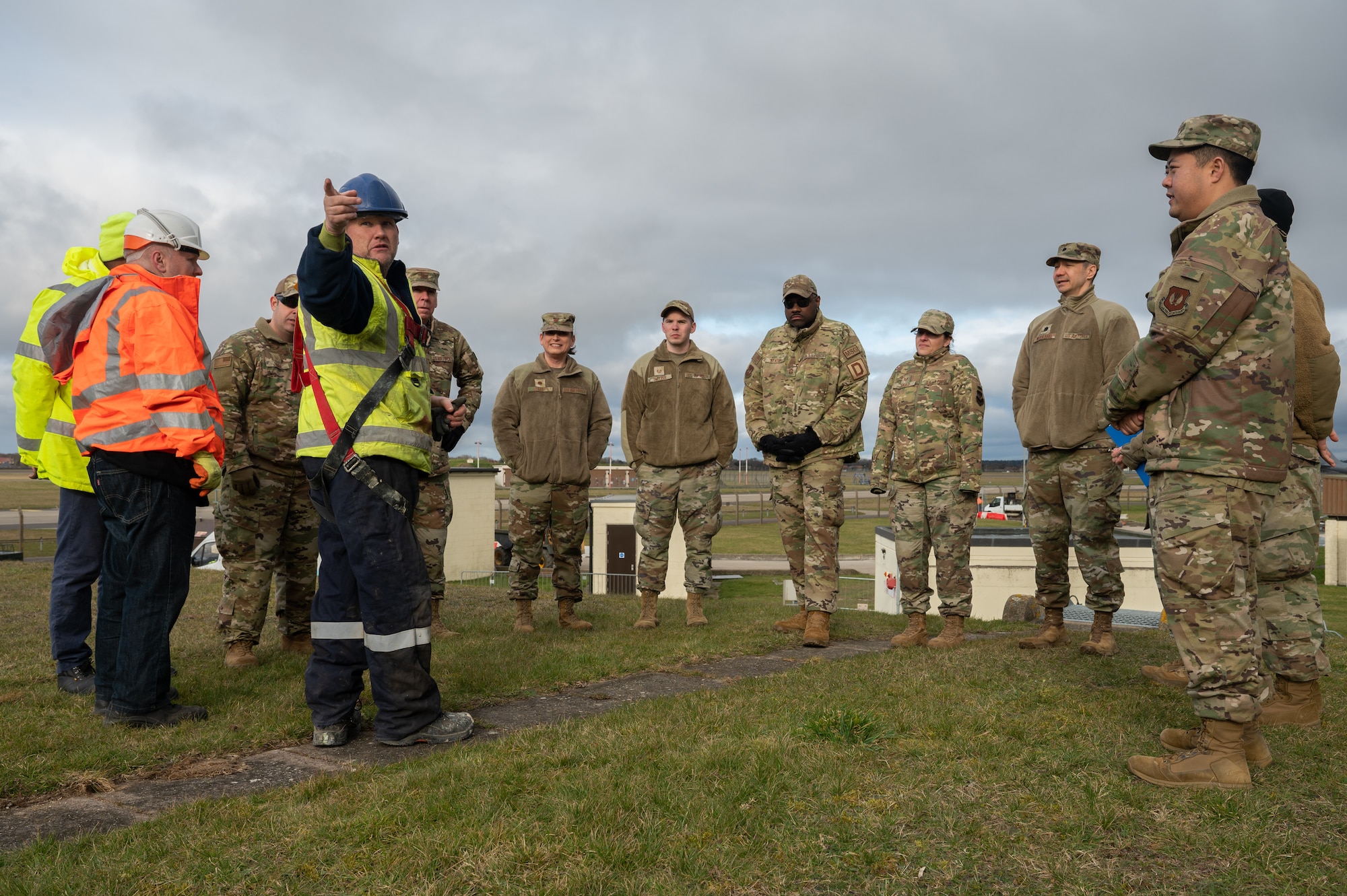 Team Mildenhall personnel listen to a short brief about the process to enter and exit an emptied jet fuel storage tank Feb. 28, 2023, at Royal Air Force Mildenhall, England.