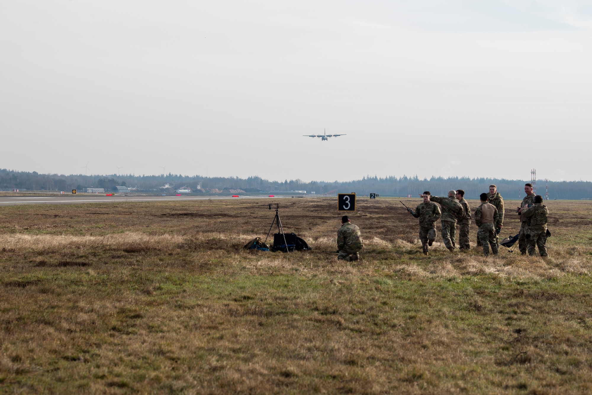 Airmen watch aircraft on flight line