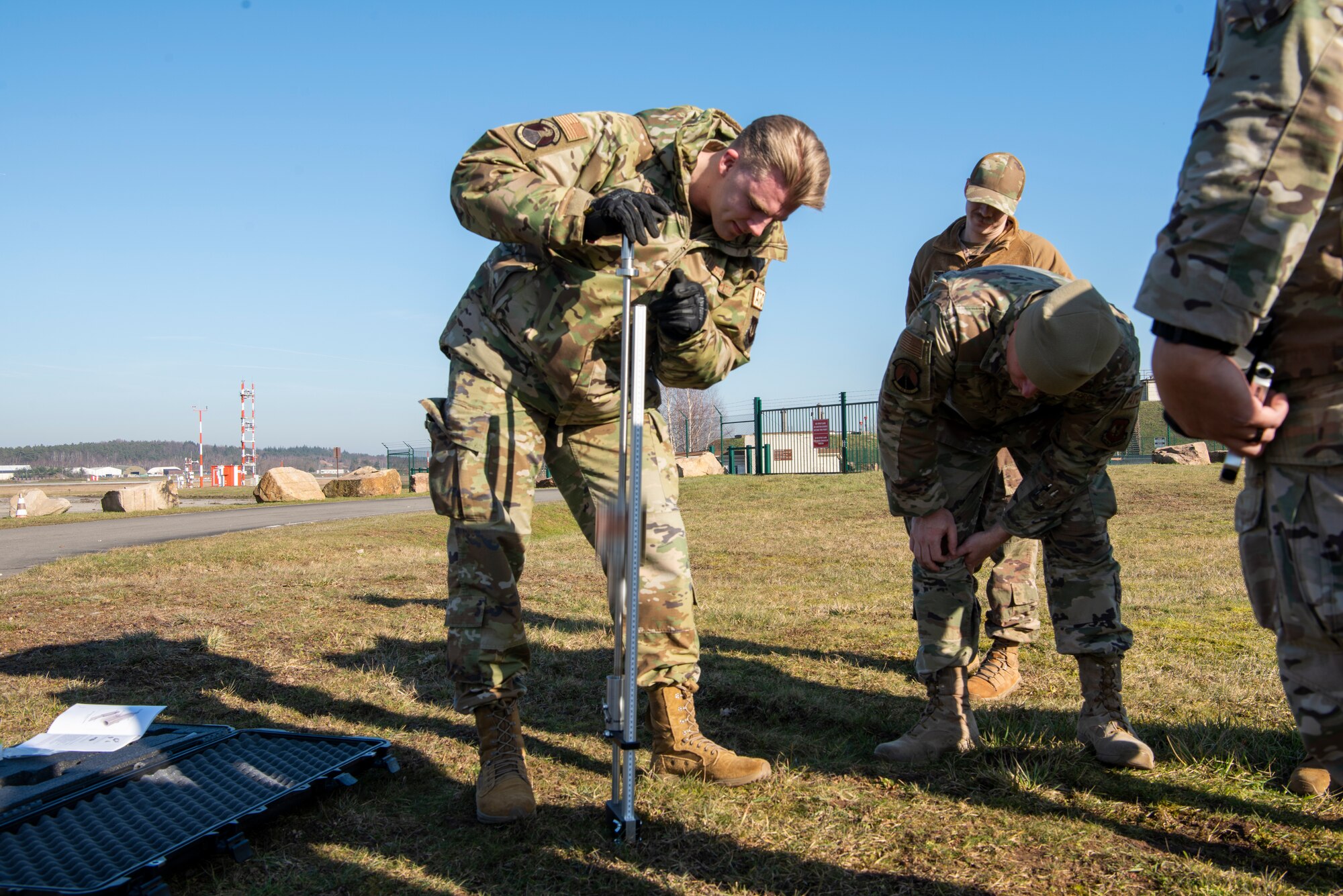 Airmen use tools in field