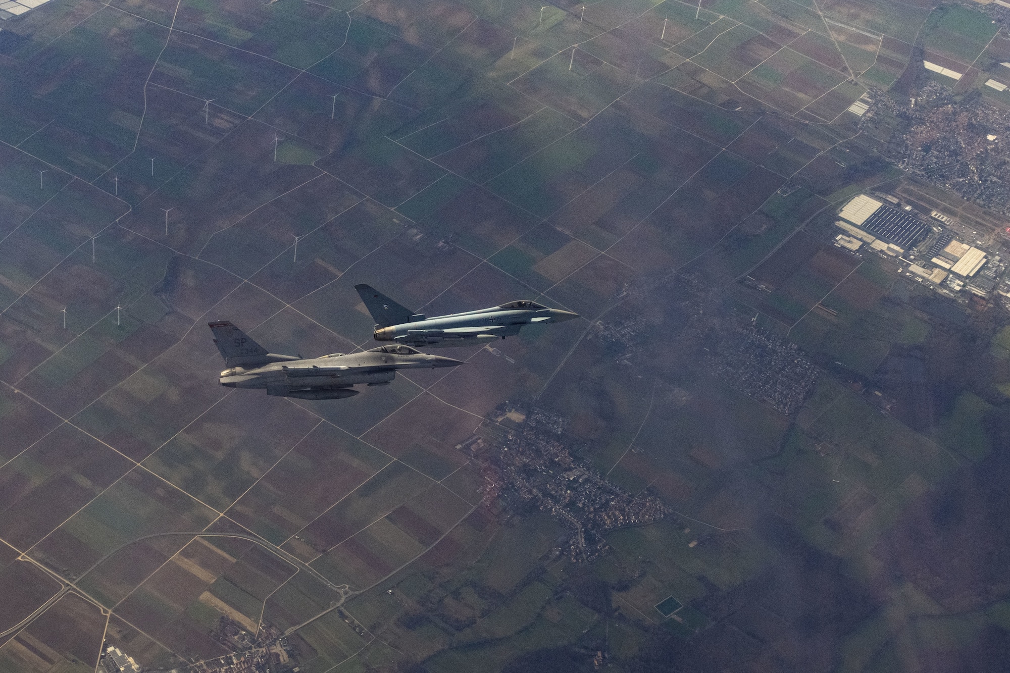 A U.S. Air Force F-16 Fighting Falcon assigned to the 480th Fighter Squadron at Spangdahlem Air Base, Germany (left), flies alongside a German air force Eurofighter Typhoon assigned to the 74th Tactical Air Wing over Germany, Feb. 16, 2023.