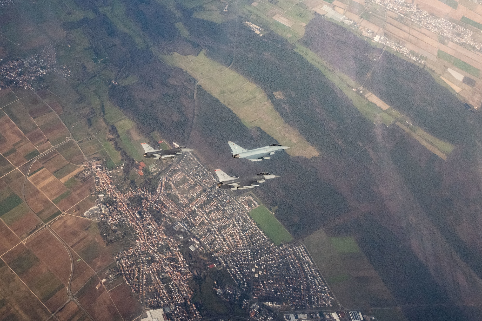 U.S. Air Force F-16 Fighting Falcon assigned to the 480th Fighter Squadron at Spangdahlem Air Base, Germany, flies alongside a German air force Eurofighter Typhoon assigned to the 74th Tactical Air Wing over Germany, Feb. 16, 2023.