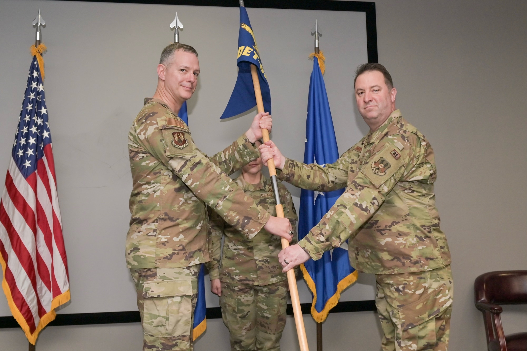 Lt. Gen. Alexus G. Grynkewich passes guidon flag to Col. Robert G. Smoker.