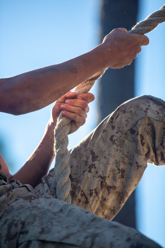 Recruits with Oscar Company, 4th Recruit Training Battalion, maneuver through obstacles on the confidence course aboard Marine Corps Recruit Depot Parris Island, S.C., Oct. 20, 2022. The confidence course consists of various obstacles that challenges recruits both physically and mentally. (U.S. Marine Corps photo by Lance Cpl. Trent A. Henry)