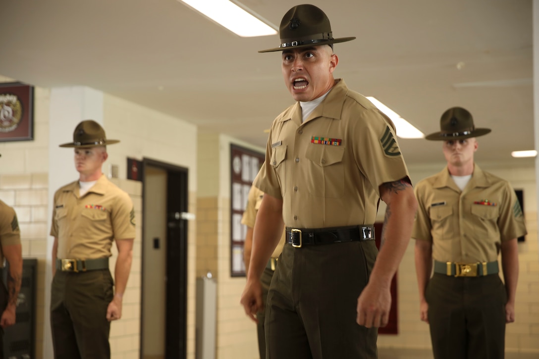 Drill instructors with Oscar Company, 4th Recruit Training Battalion, introduce themselves to their recruits on Marine Corps Recruit Depot Parris Island, S.C., June 25, 2022. Oscar Company will spend forming day one learning the rules and regulations of recruit training. (U.S. Marine Corps photo by Cpl. Ryan Hageali)