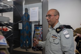 An Israeli Defense Forces soldier showcases Israeli artifacts during Juniper Falcon 2023, Feb. 15, 2023. JF23 is a bilateral exercise designed to improve the cooperative defense of Israel between the U.S. and the Israeli Defense Forces.