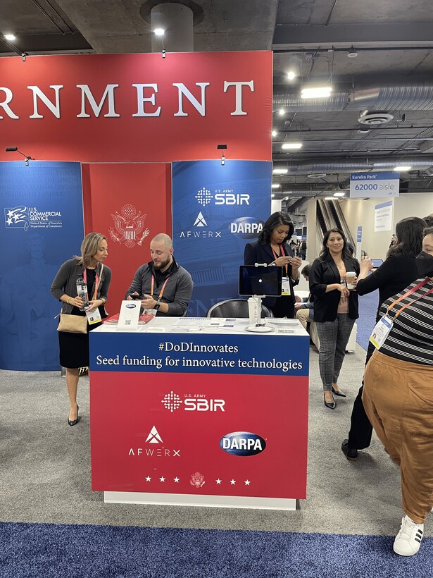 DoD (US Army, AFWERX, and DARPA) Tabletop at USG Resources for Startups and Small Businesses at CES 2023, Las Vegas, Nevada

Pictured Left to Right: Jennifer Thabet (Program Director, DARPA Small Business Programs Office), Aaron Sparks (DARPA Contractor Support), Kellyn White (Air Force Contractor Support), and Tara Clinton (Army Contractor Support)