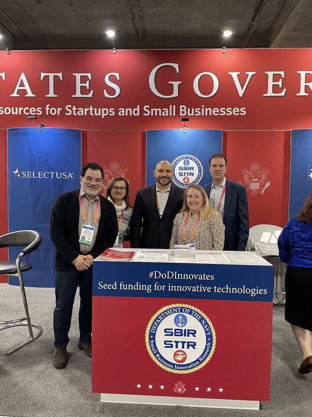 Navy Tabletop at USG Resources for Startups and Small Businesses at CES 2023, Las Vegas, Nevada

Pictured Left to Right: Antonio Rodriguez (Contractor Support), Kathy Fontana (Contractor Support), Michael Pyryt (Navy SSP SBIR/RIF PM), Megan Stokes (Contractor Support), and Brian Shipley (Navy SBIR/STTR Commercialization PM)