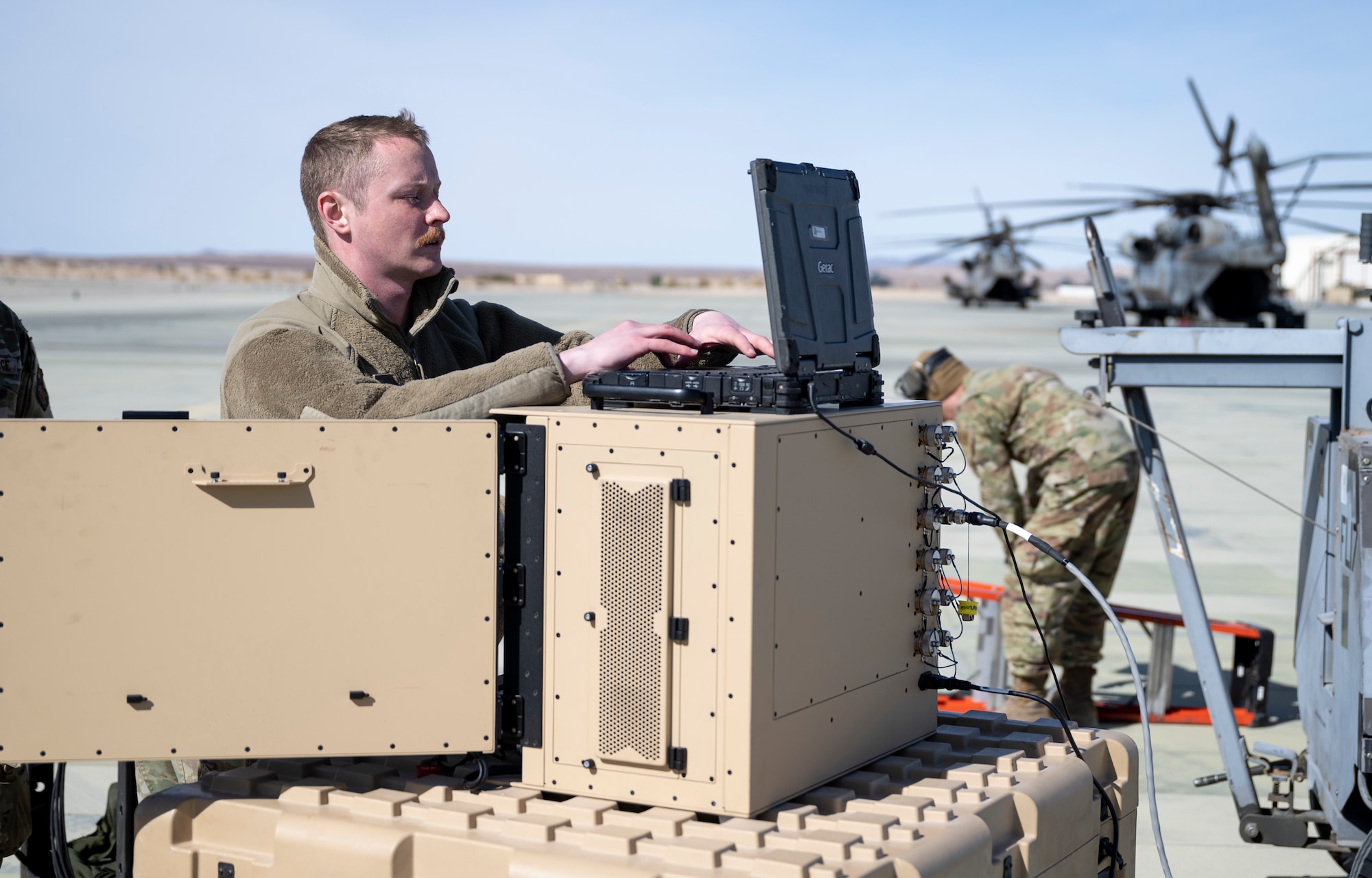 U.S. Air Force Staff Sgt. Shaun Shaffer, 29th Aircraft Maintenance Unit assisted dedicated crew chief, uses a Portable Aircraft Control Station at Marine Corps Air Ground Combat Command Center, Twentynine Palms, California, Feb. 16, 2023. Agile Combat Employment Reaper 23.6 is an exercise that was conducted between Holloman Air Force Base, Cannon AFB, N.M., Creech AFB, Nevada, and the U.S. Marines at Twentynine Palms. (U.S. Air Force photo by Staff Sgt. Kristin West)