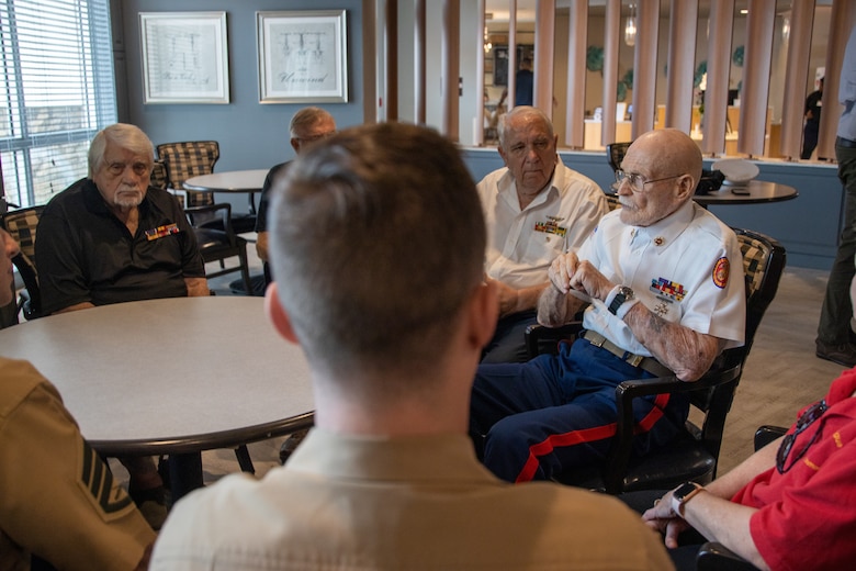 U.S. Marine Corps veteran Glenn Galtere, a 93-year-old Marine who fought in The Battle of Chosin Reservoir in the Korean War, tells his Marine Corps story at the Iwo Jima Luncheon held at The Madyson at Palm Beach Gardens, Florida, Feb. 23, 2023. The Iwo Jima Luncheon was organized by U.S. Marine Corps veterans Joe Lisi and Tom Kane, together with Madyson staff members to honor those who answered the call of duty for the defense of our nation. (U.S. Marine Corps photo by Lance Cpl. Kevin Lopez Herrera)