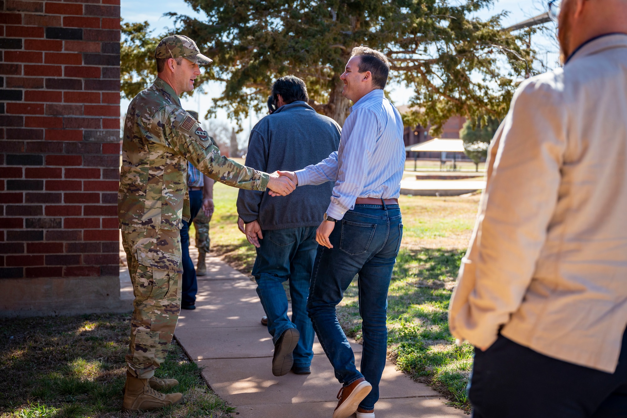 U.S. Air Force Col. Joseph Kramer, 7th Bomb Wing commander, shakes hands with local religious leaders during the Dyess Clergy Day tour at Dyess Air Force Base, Texas, Feb. 28, 2023. Clergy Day is an annual event the Dyess AFB Chaplain Corps hosts to forge rapport and relationships with local clergy of all faith backgrounds who support the Dyess community. (U.S. Air Force photo by Senior Airman Leon Redfern)