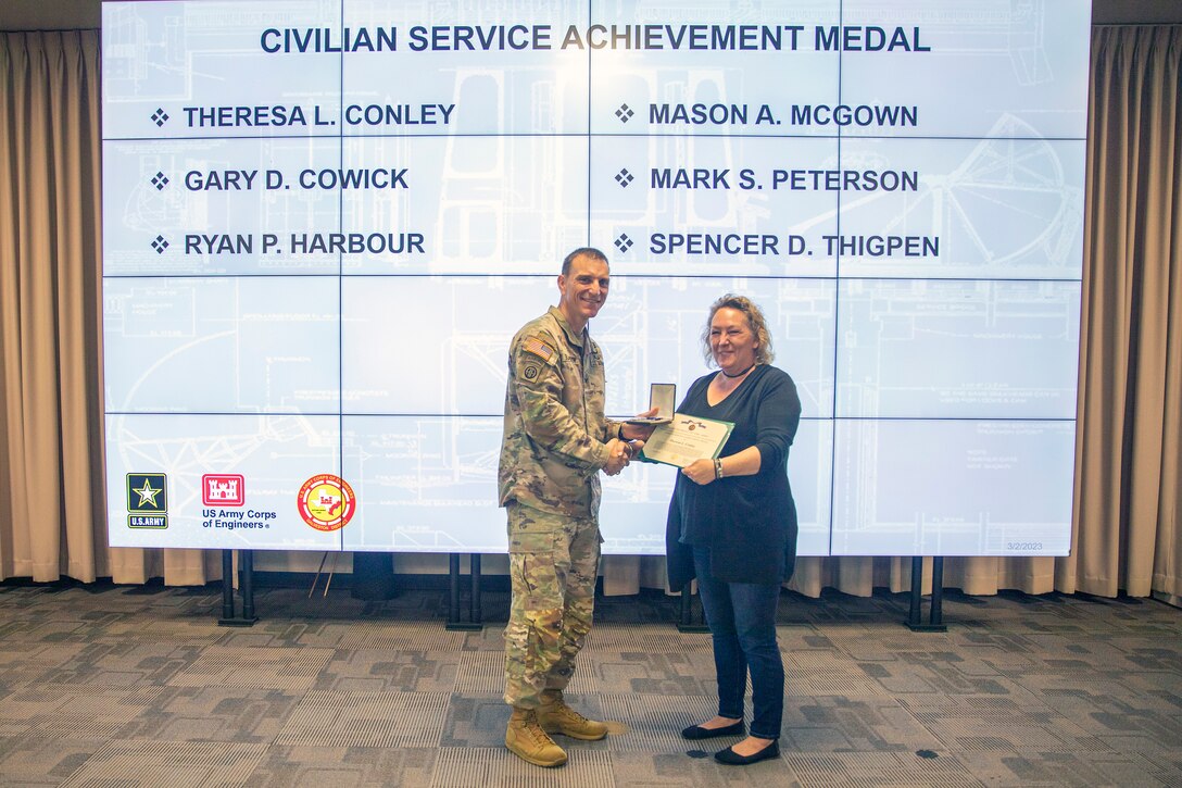 U.S. Army Corps of Engineers (USACE) Galveston District Commander Col. Rhett Blackmon [left] recognizes Theresa L. Conley with an Army Civilian Service Achievement Medal during an awards ceremony, March 2, 2023.

Conley was recognized for her exceptional service as the Hurricane Ian Recovery Office’s ENGLink lead from October 9 to November 3, 2022. 

The ceremony recognized employees for their significant individual achievements and group accomplishments during the second quarter of Fiscal Year 2023.