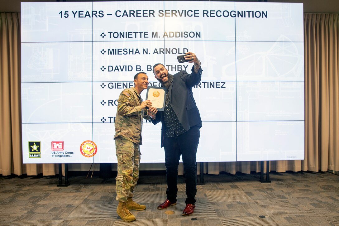 U.S. Army Corps of Engineers (USACE) Galveston District Commander Col. Rhett Blackmon [left] recognizes Trevor Welsh, a photographer and avid selfie fan, for his 15 years of federal service during an awards ceremony, March 2, 2023.

The ceremony recognized employees for their significant individual achievements and group accomplishments during the second quarter of Fiscal Year 2023.