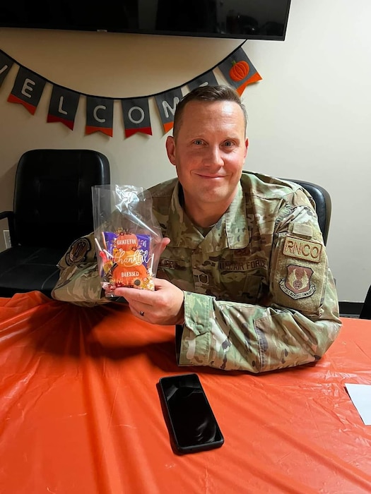 Master Sgt. Joseph Gillispie, 88th Force Support Squadron Military & Family Readiness Center noncommissioned officer, displayed a bag of candy Nov. 8, 2022, during the "Thankful for my Military Family" event at Wright-Patterson Air Force Base, Ohio. The M&FRC supports individuals, families and leadership with programs and services to strengthen communities, encourage self-sufficiency, enhance mission readiness and ease adaptation to the Air Force way of life. (Contributed Photo)