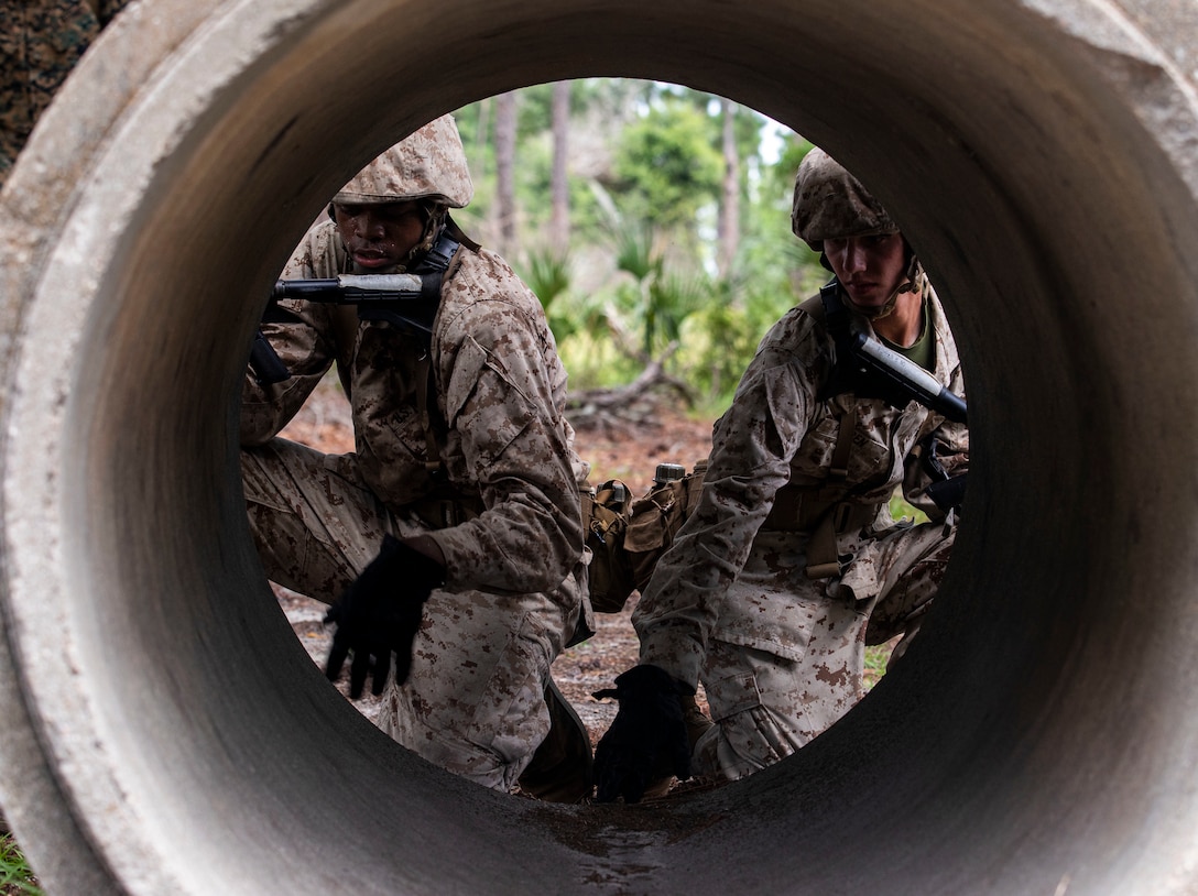 Recruits with Charlie Company, 1st Recruit Training Battalion, execute the day movement course during Basic Warrior Training (BWT) on Marine Corps Recruit Depot Parris Island S.C., July 13, 2022. BWT is a week long training event that teaches recruits the basics of combat survival, field skills, and rifle maneuvers. (U.S. Marine Corps photo by Lance Cpl. Michelle Brudnicki)