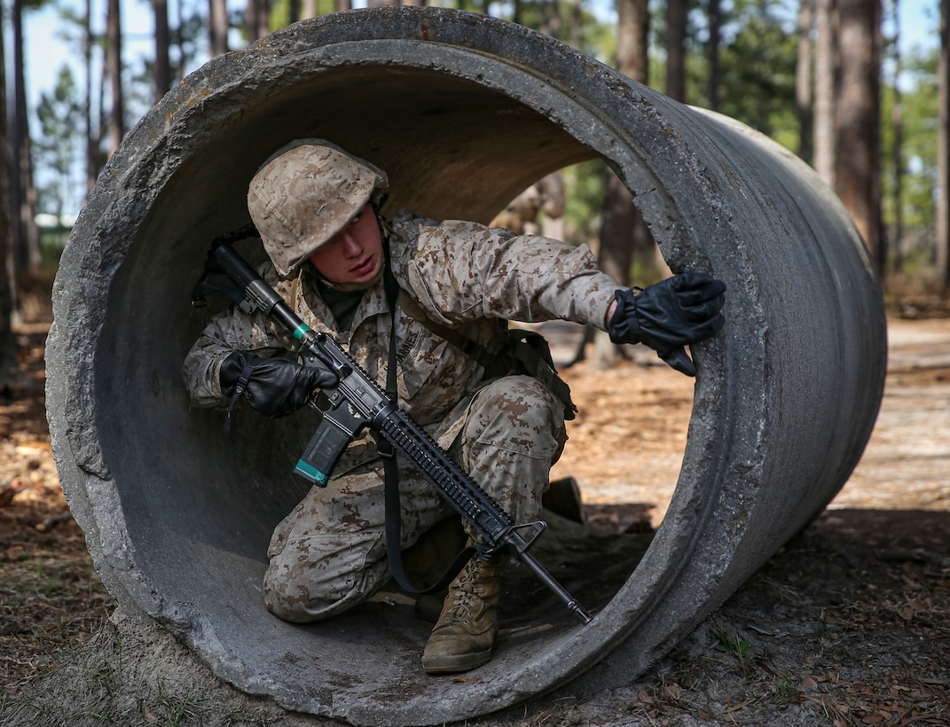 A recruit with Charlie Company, 1st Recruit Training Battalion, conduct the Day Movement Course during Basic Warrior Training aboard Marine Corps Recruit Depot Parris Island, S.C., Feb. 9, 2023. Basic Warrior Training is a one-week-long training event that teaches recruits the basics of combat survival and rifle maneuvers.