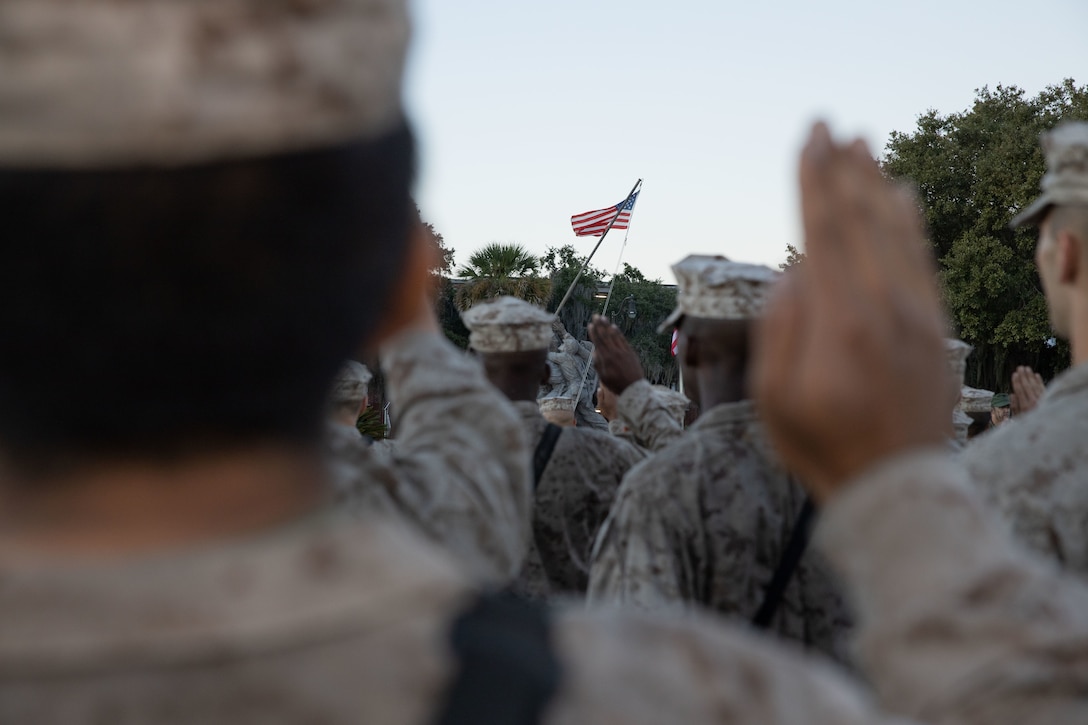 U.S. Marines with Papa Company, 4th Recruit Training Battalion, recite the Oath of Enlistment on Marine Corps Recruit Depot Parris Island, S.C., Oct. 21, 2022. The EGA is the official emblem and insignia of the Marine Corps. (U.S. Marine Corps photo by Cpl. Luis Arturo Ponce Alavez Jr.)
