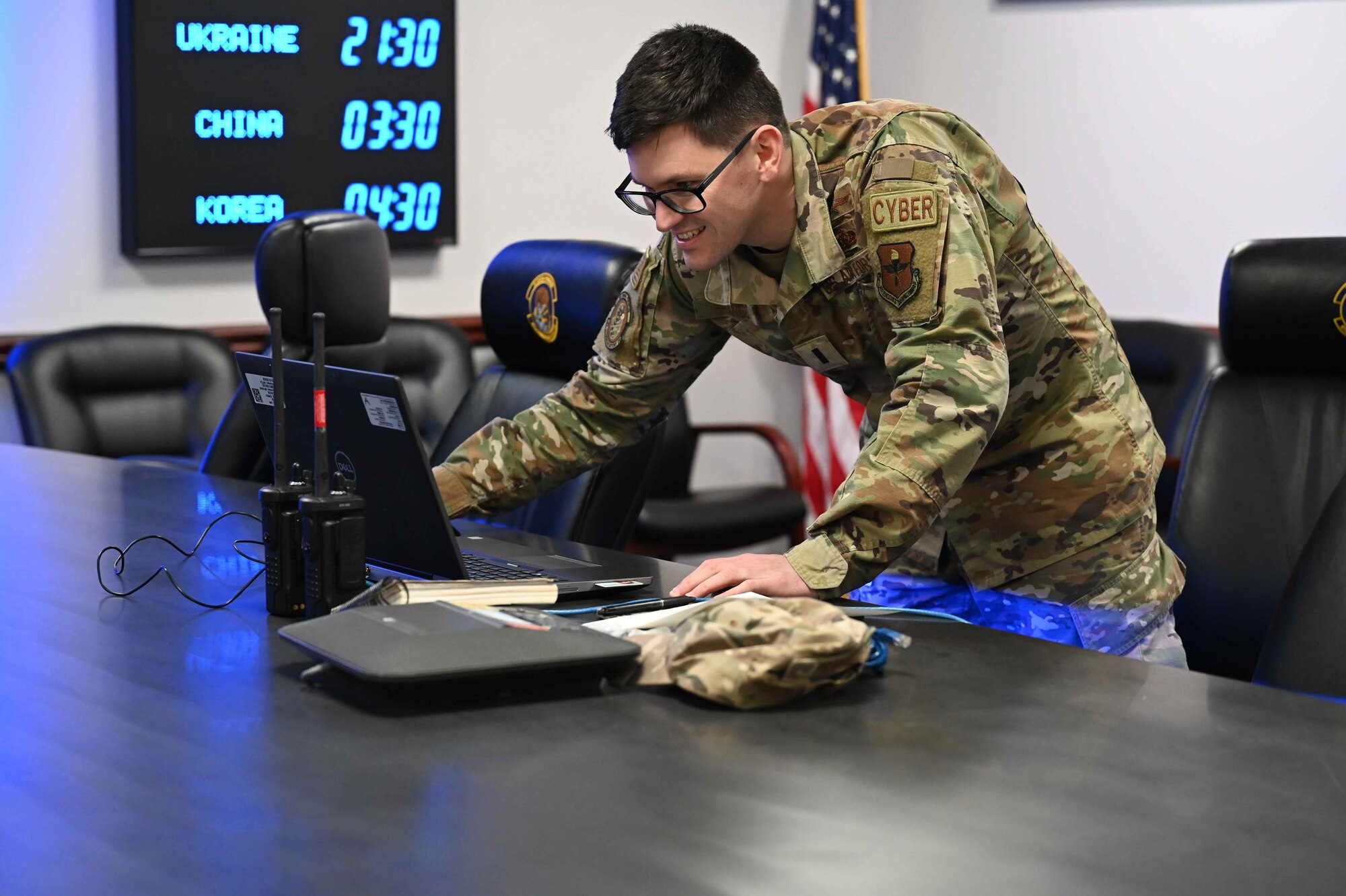 U.S. Air Force 1st Lt. Alexander Franco, 97th Communications Squadron (CS) officer in charge of quality assurance, does a last-minute check before announcing the start of a readiness exercise at Altus Air Force Base, Oklahoma, Feb. 23, 2023. The 97 CS Airmen began their exercise in mission-oriented protective posture gear level zero, which includes normal uniform, helmets, and vests. (U.S. Air Force photo by Airman 1st Class Kari Degraffenreed)